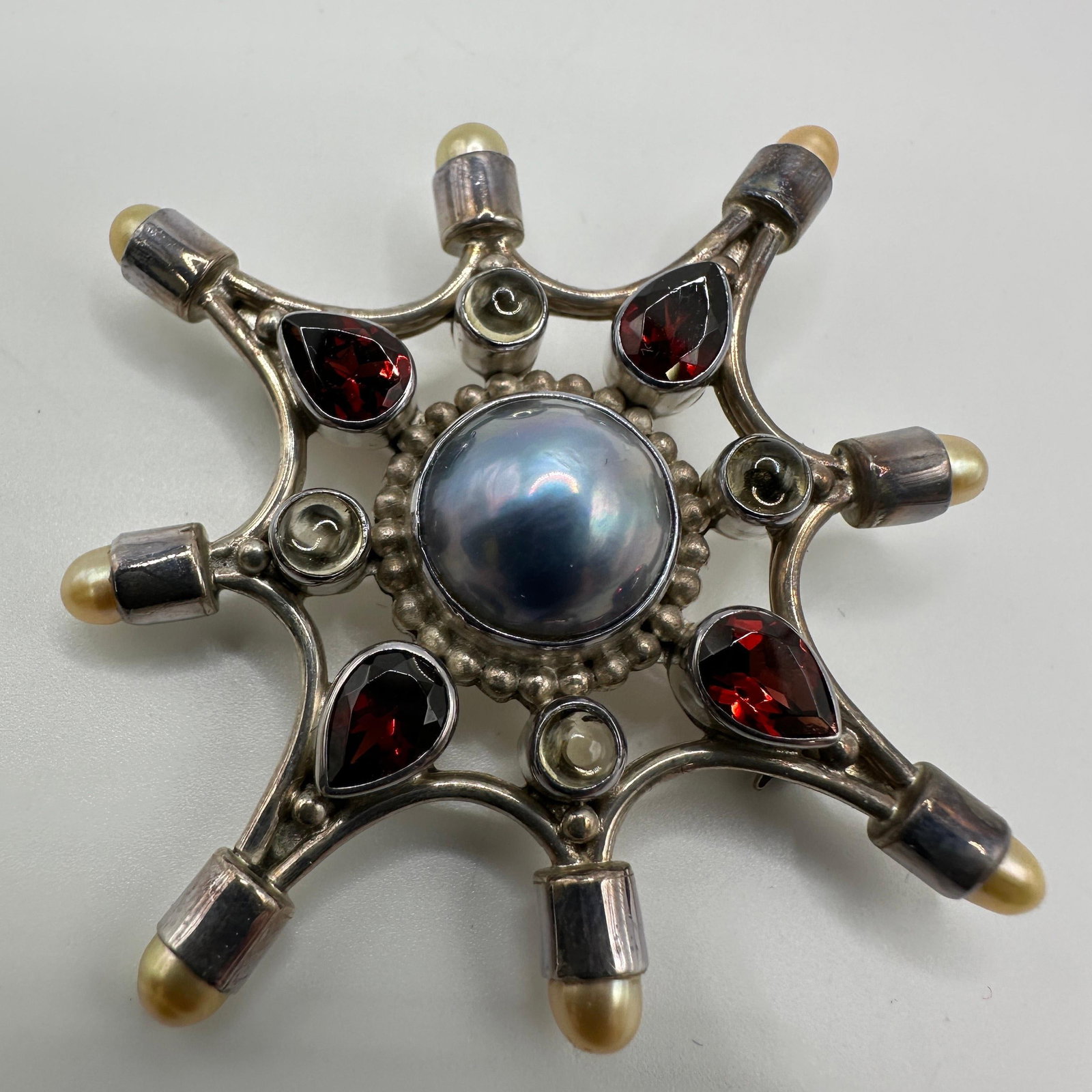 Sajen Sterling Silver Faux Pearl Garnet Brooch Pendant: This item is in good pre-owned, previously used/displayed condition with noticeable light wear and surface scratches. Please reference all photos for full details. This piece of jewelry has been caref