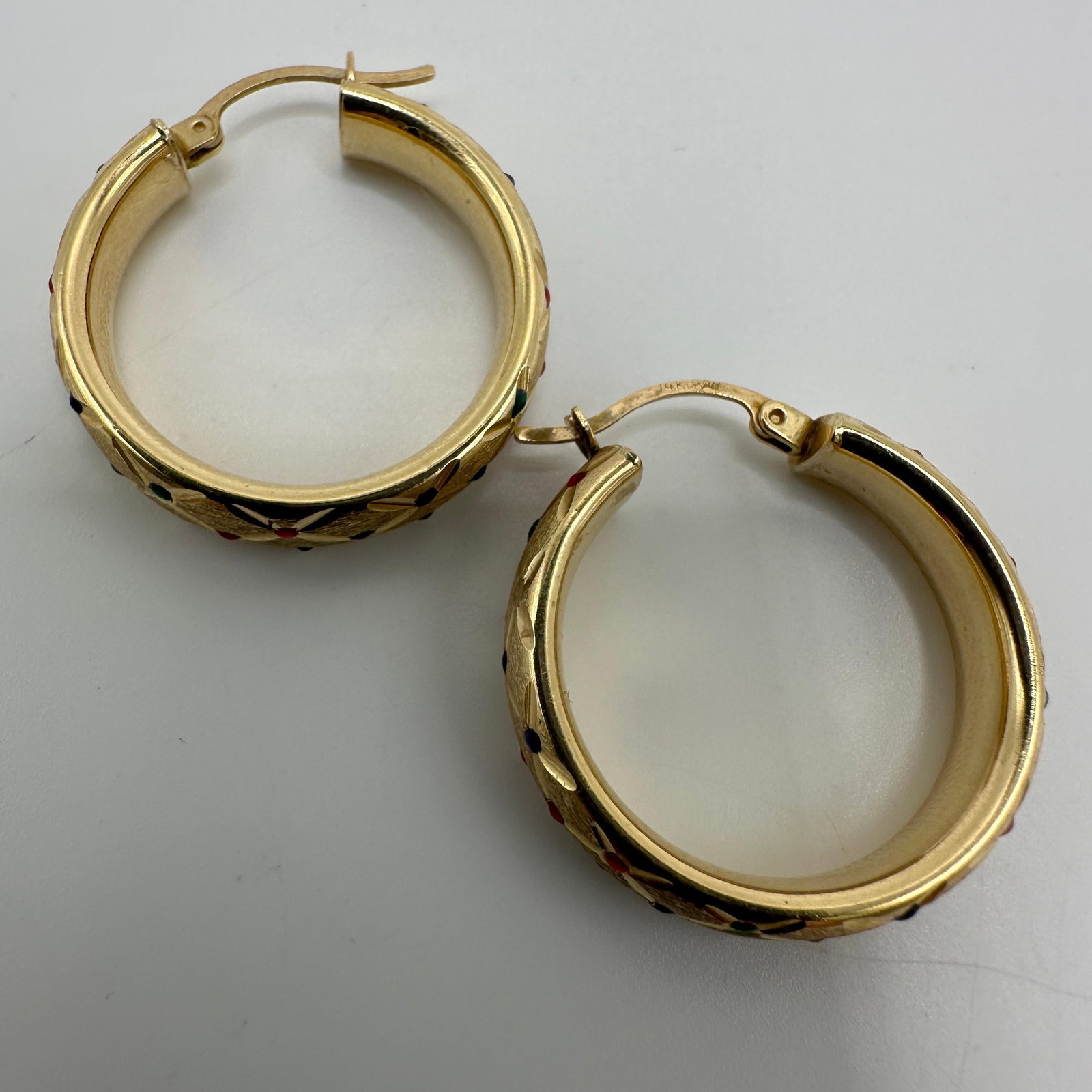 Multi Colored Accent 14K Gold Hoop Earrings A52: This item is in good pre-owned condition, previously used/displayed, with noticeable light wear and surface scratches. Please reference all photos for full details. This piece of jewelry has been care