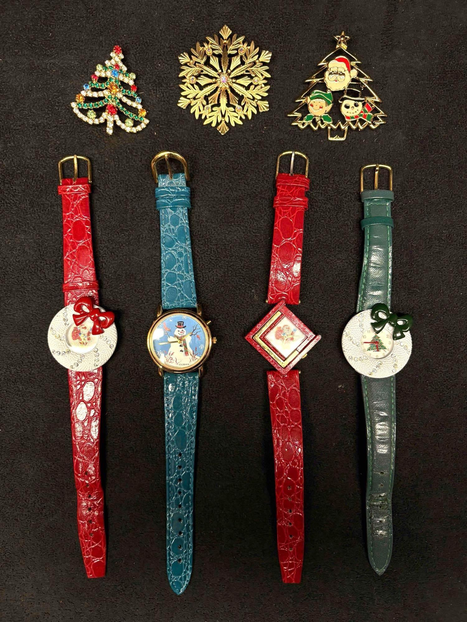 7pc Vintage Watches and Brooches Holiday Collection: This lot consists of pre-owned, festive holiday themed vintage vegan leather watches (x4) and enamel or rhinestone brooches (x3). The wristband of each watch shows minor fraying and wear due to age, b