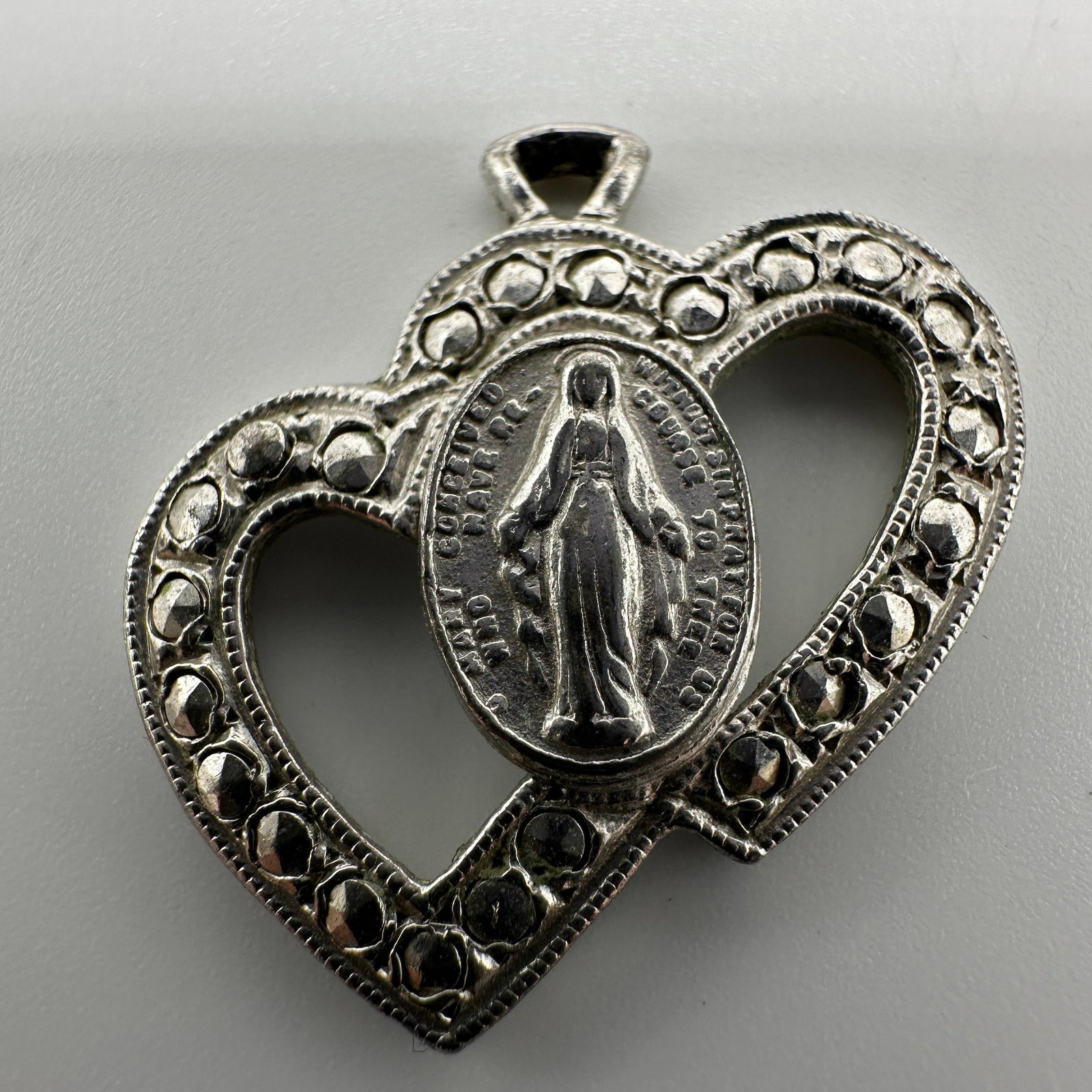 Sterling Silver Miraculous Medal Heart Pendant: This item is in good pre-owned, previously used/displayed condition with noticeable light wear and surface scratches. Please reference all photos for full details. This piece of jewelry has been caref