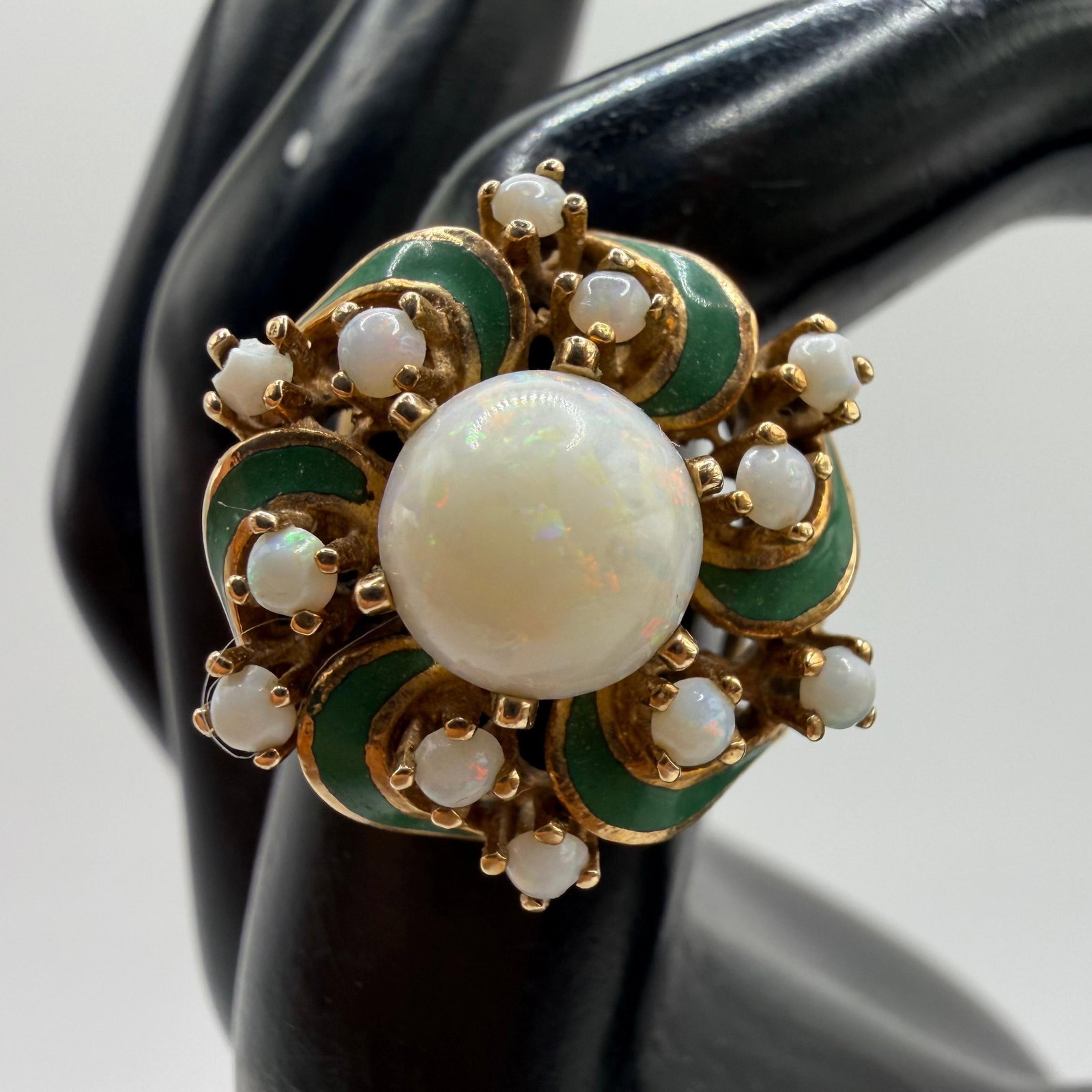 Cocktail Ring 14K Yellow Gold White Opal Green Enamel Accents: This item is in good pre-owned condition, previously used/displayed, with noticeable light wear and surface scratches. Please reference all photos for full details. This piece of jewelry has been care
