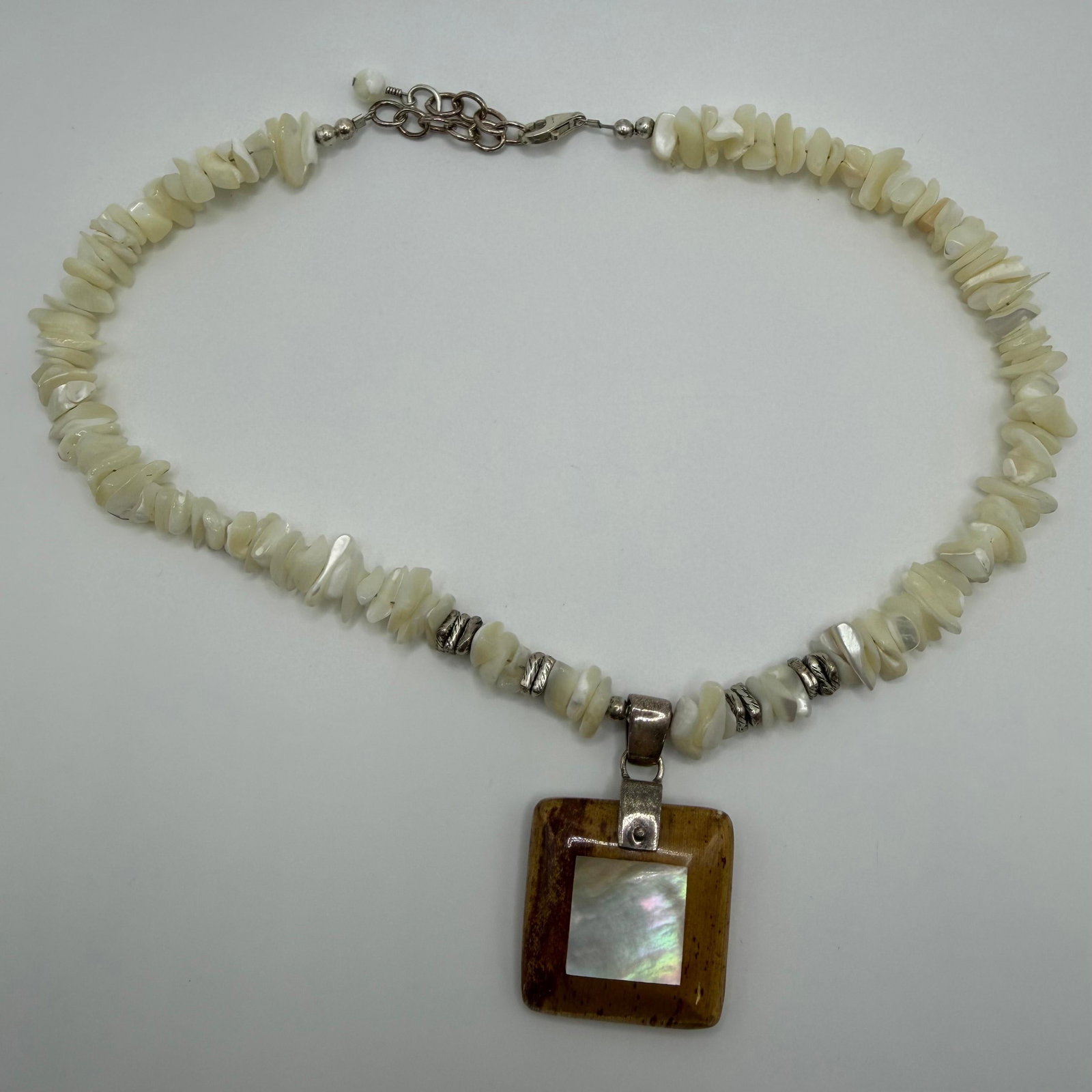Sterling Silver MOP Inlaid Wood Shell Chip Necklace: This item is in good pre-owned, previously used/displayed condition with noticeable light wear and surface scratches. Please reference all photos for full details. This piece of jewelry has been caref