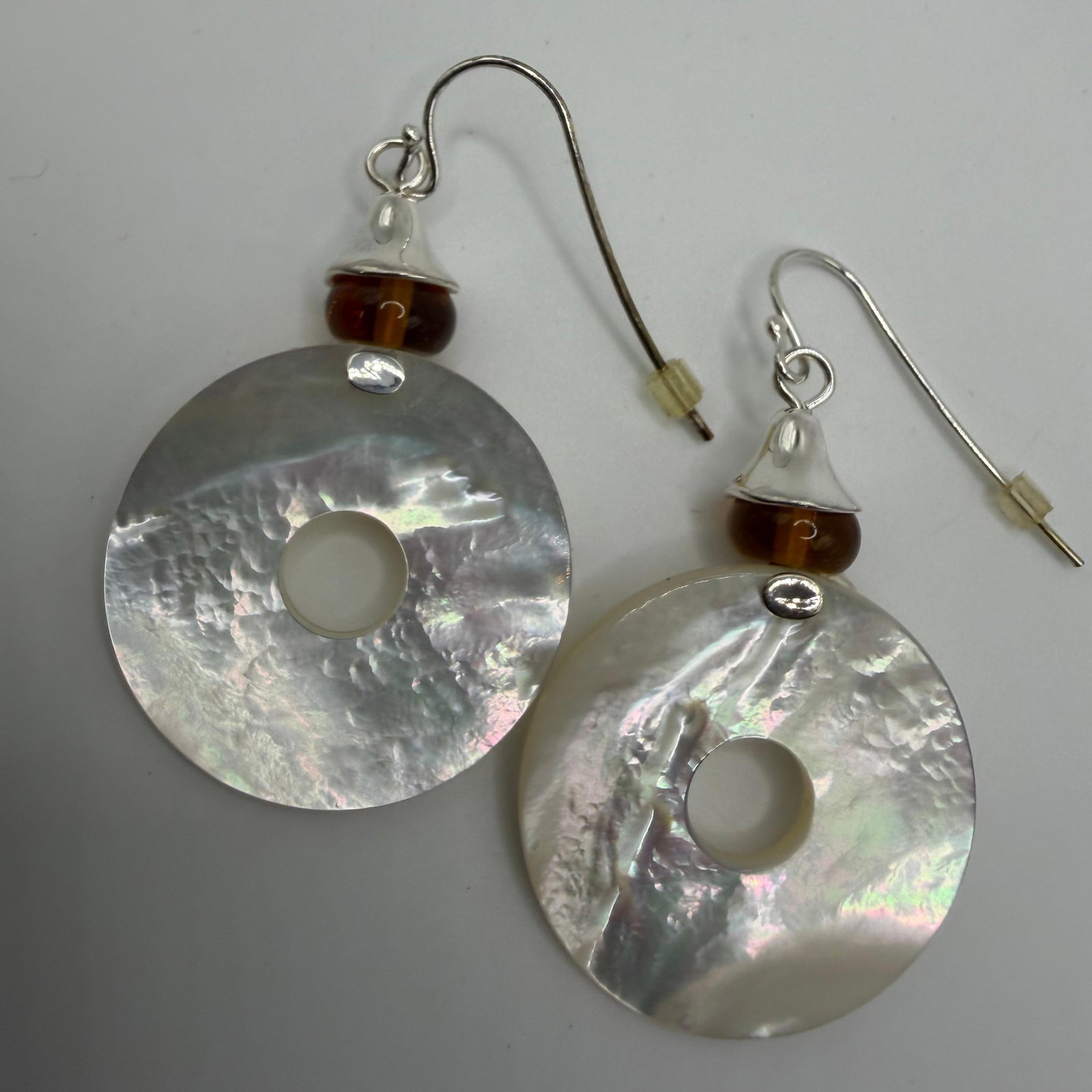 RLM Studio Mother Of Pearl Disk Art Glass Bead Sterling Earrings: This item is in good pre-owned, previously used/displayed condition with noticeable light wear and surface scratches. Please reference all photos for full details. This piece of jewelry has been caref