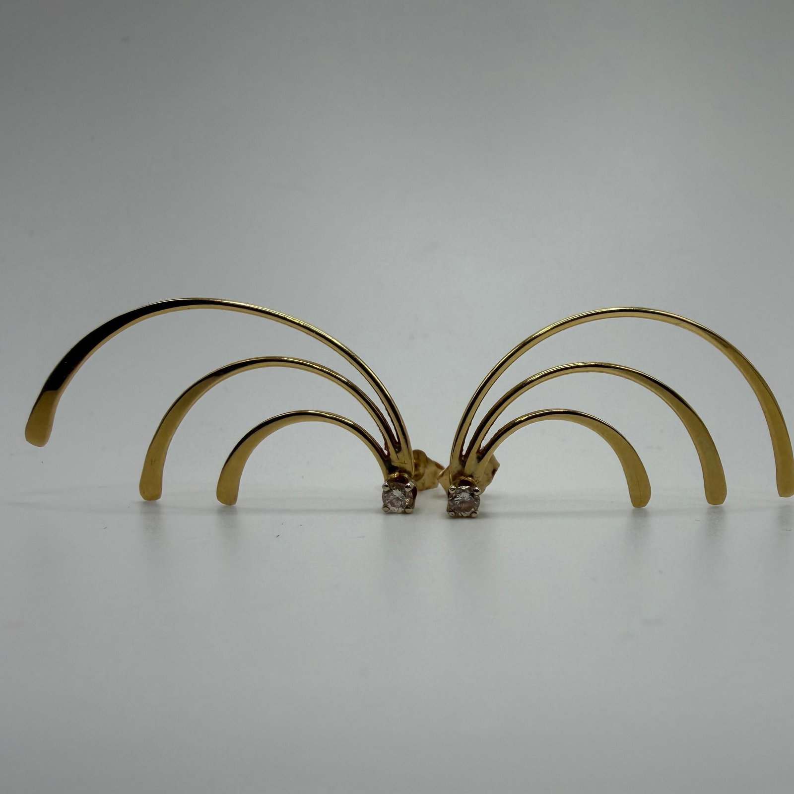 14K Yellow Gold Delicate Arch Fan-Shaped Accent Diamond Earrings: This item is in good pre-owned condition, previously used/displayed, with noticeable light wear and surface scratches. Please reference all photos for full details. This piece of jewelry has been care