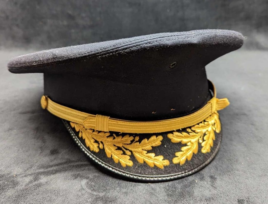 Vintage Bancroft Military Cap: Vintage Bancroft Military Cap. Does not say what size it is, but it should fit most adult heads. Is approx 10" x 11" x 5" and it weighs 0.47lb. The hat is in good, vintage condition with visible stapl