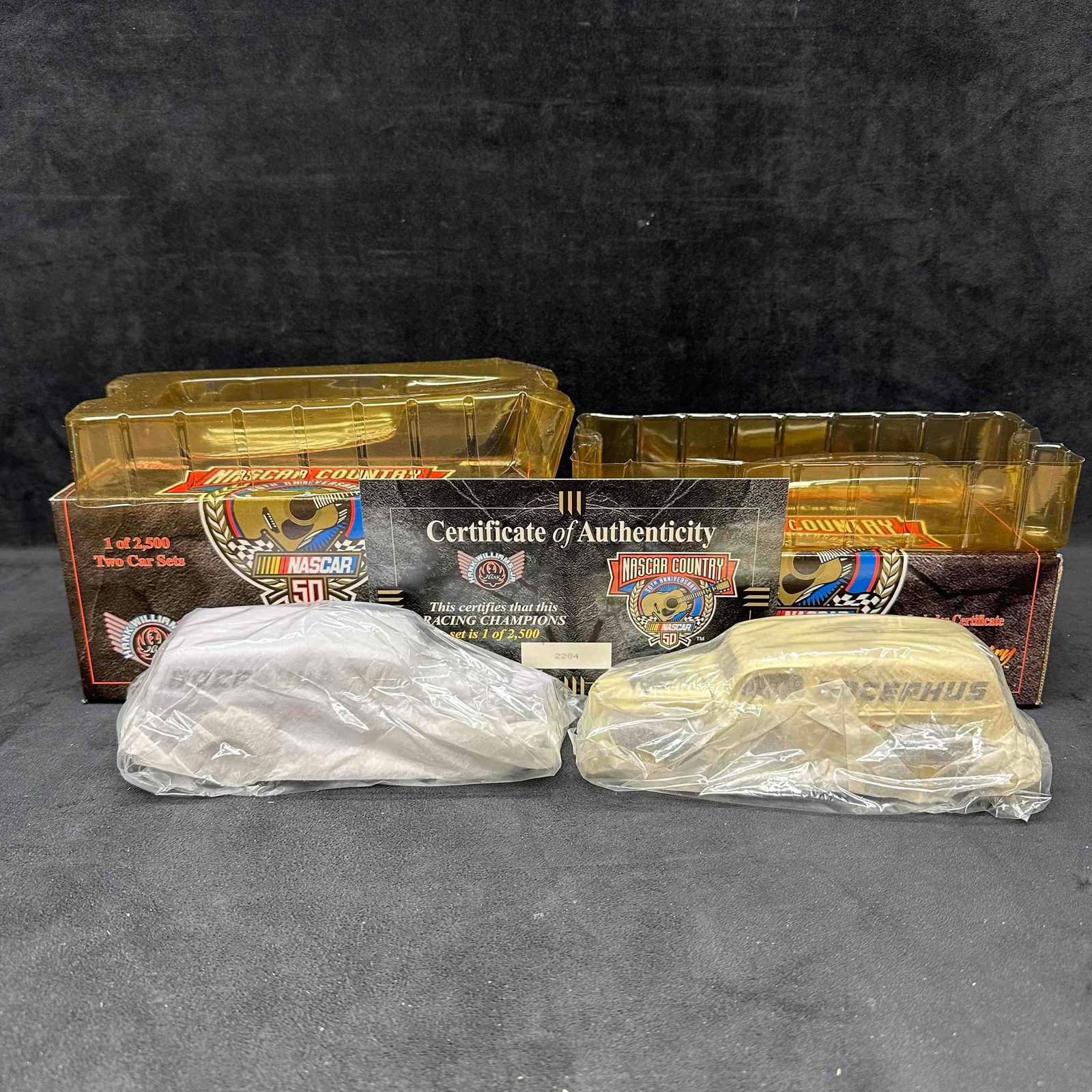 NASCAR Hot Country Steel Hank Williams Bocephus ‘40 Ford Delivery 1/24 Set: NASCAR Hot Country Steel Hank Williams Bocephus ‘40 Ford Delivery 1/24 Set. 1 of 2500 Racing Champions two car set. Includes original box and Certificate of Authenticity. These items are in