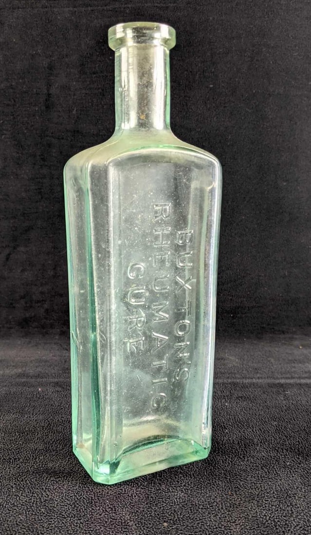 Antique Medicine Bottle Buxton's Rheumatic Cure: Antique Medicine Bottle Buxton's Rheumatic Cure This is a large bottle of Buxton's Rheumatic Cure. This medicine bottle is from about 1880. It is embossed BUXTON'S RHEUMATIC
