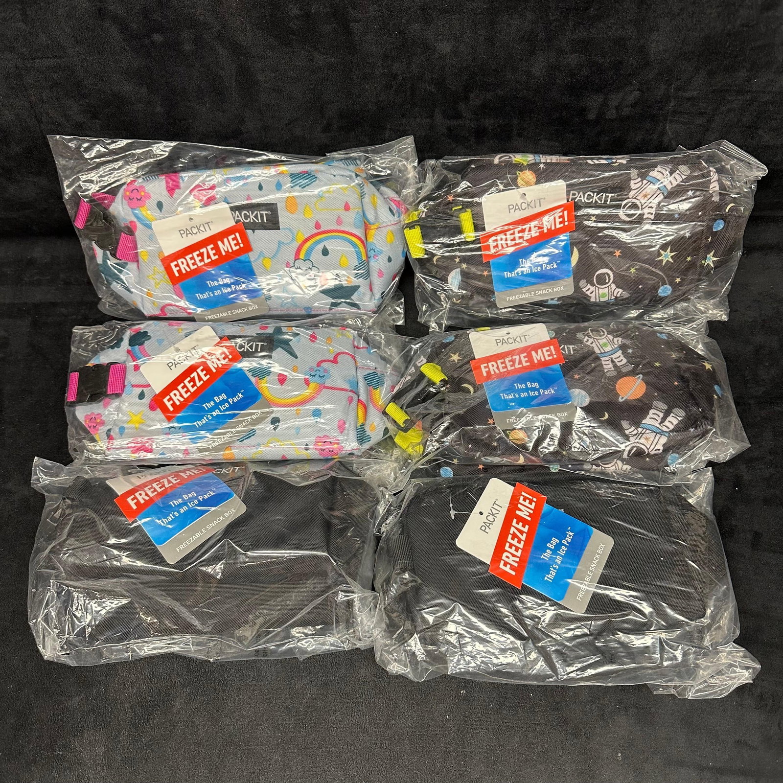 Pack It Freeze Me Freezable Snack Lunch Box Set Six: Brand New sealed Pack It Freezable Snack Box set of six, collection of plain black, rainbow design, and space style. These items are in like-new sealed, previously displayed condition with light 