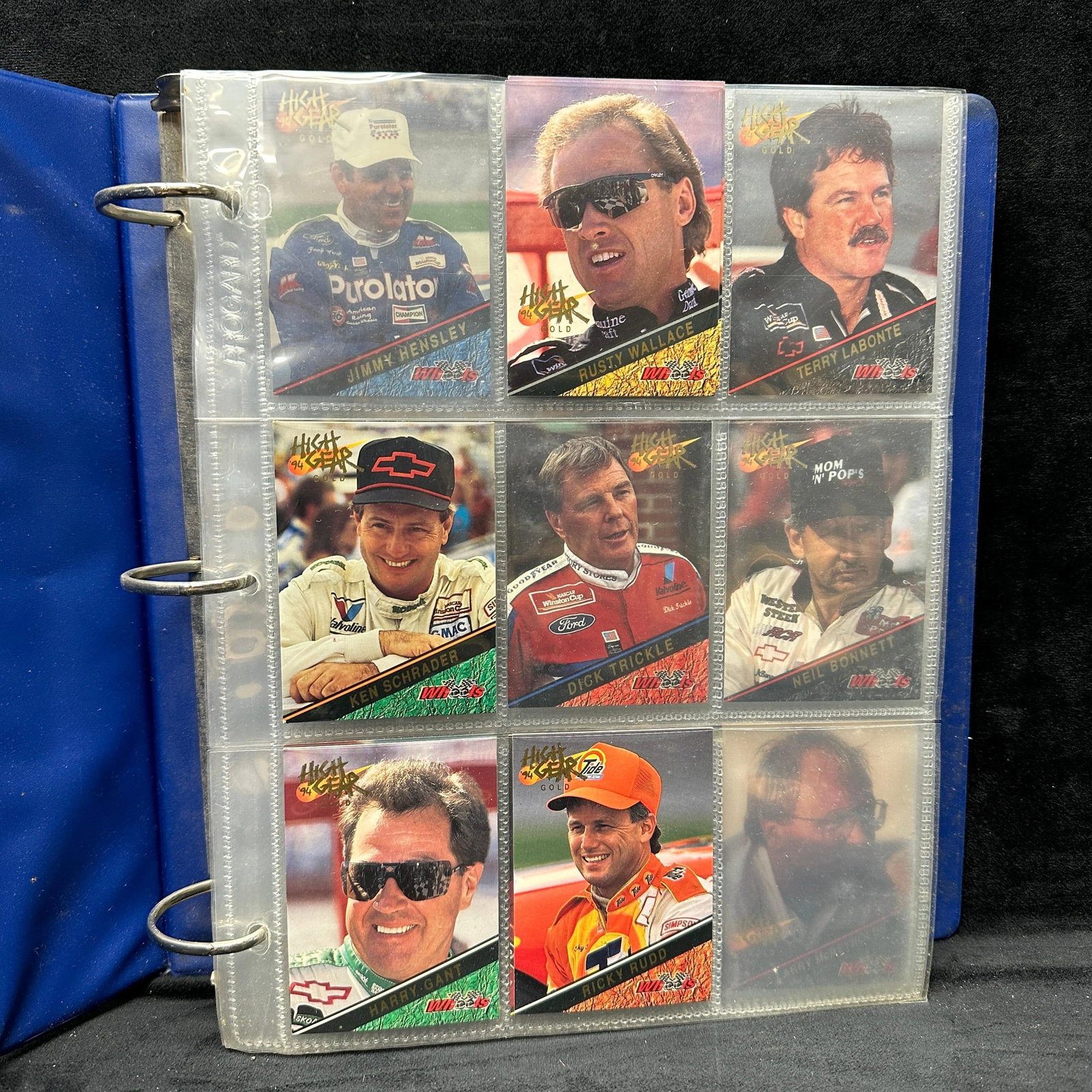 90s NASCAR Race Racing Sport Card Lot with Blue Binder 57 Cards: A lot of 57 cards total, all NASCAR 1990's racing sport cards with duplicates. Cards are kept in a protective binder, and overall appear in good collectible condition, with the binder showing ligh