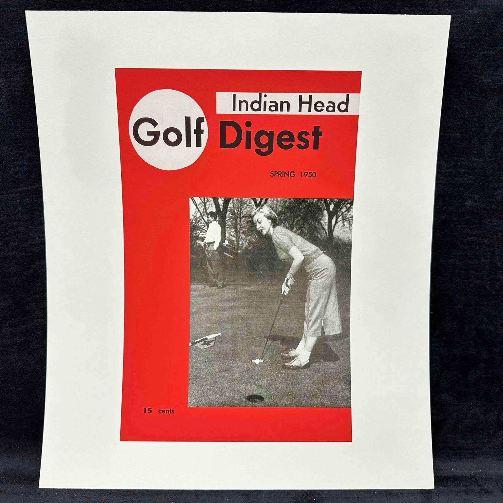 Magazine Cover Reprint Indian Head Golf Digest Spring 1950 Lithograph B: Vintage reprint of the Spring 1950 issue of Indian Head Golf Digest, featuring a black-and-white photograph of a woman golfer putting on the green, with a male golfer in the background. Cover printed 