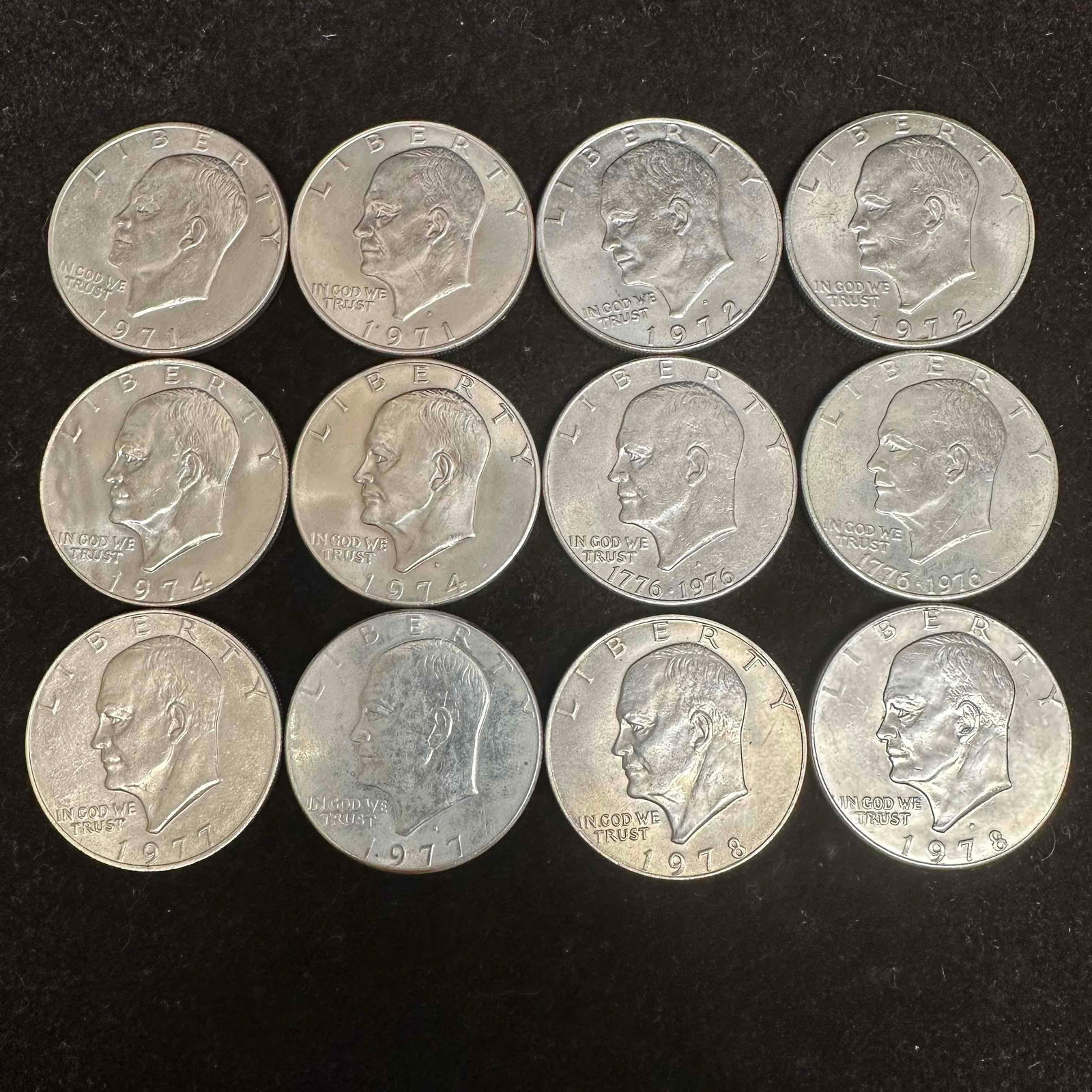 Eisenhower Dollars 1971-1978 Coin Collection 12 Dollar Coins: These coins have been tested and researched to the best of our ability prior to listing. Please view photos, as they are a part of the condition. Two coins are uncirculated with a few coming in a plas