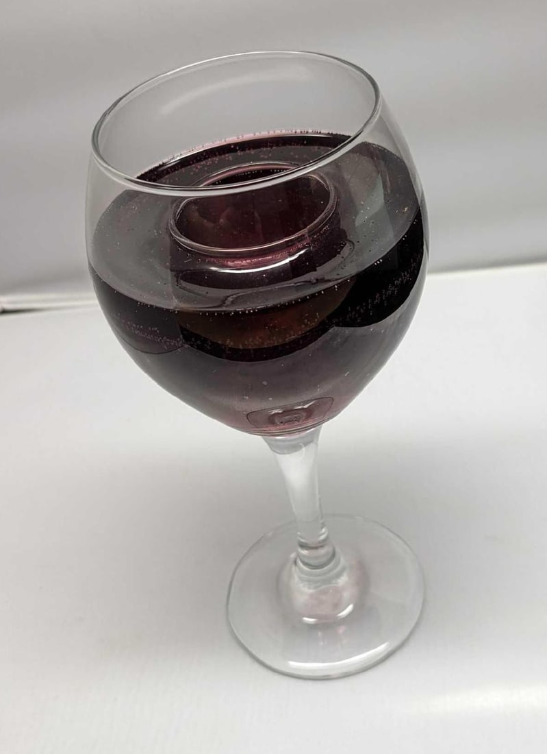 PartyLite Scents Of Illumination Vineyards Candle Holder: PartyLite Scents Of Illumination Vineyards Candle Holder. This retired wine-shaped candle holder is approx 4" x 4" x 8 1/2". It comes in its original box which is approx 6" x 6" x 11" and it weighs 2.