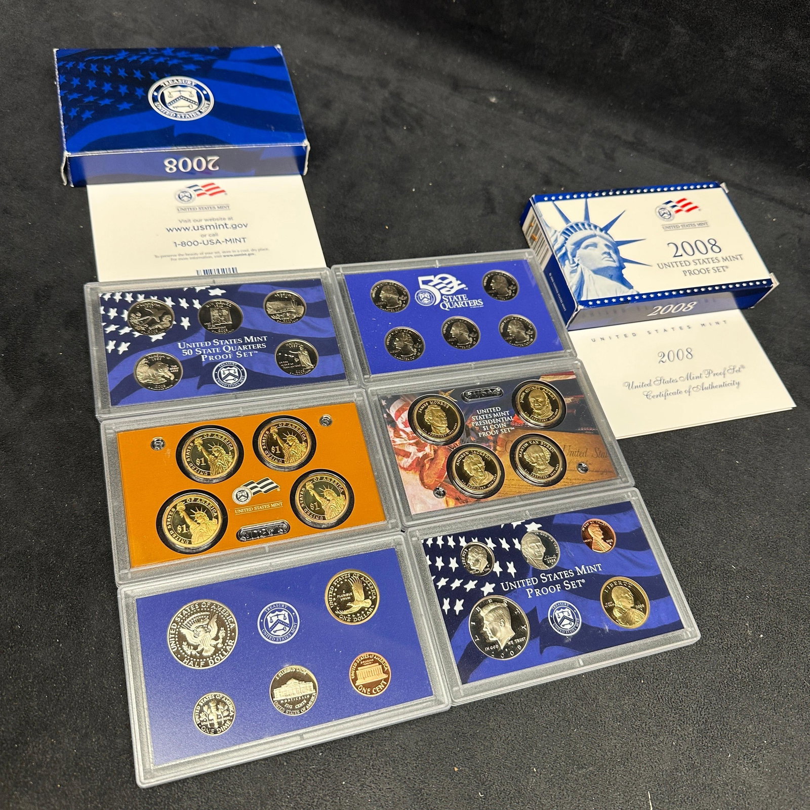 2008 US Mint Proof Set Lot With State Quarters And Presidential Dollars 28 Coins: A lot of two 2008 United States Mint proof sets, each complete with original government packaging and certificates. Includes clad proof coins featuring State Quarters, Presidential $1 coins, Sacagawea