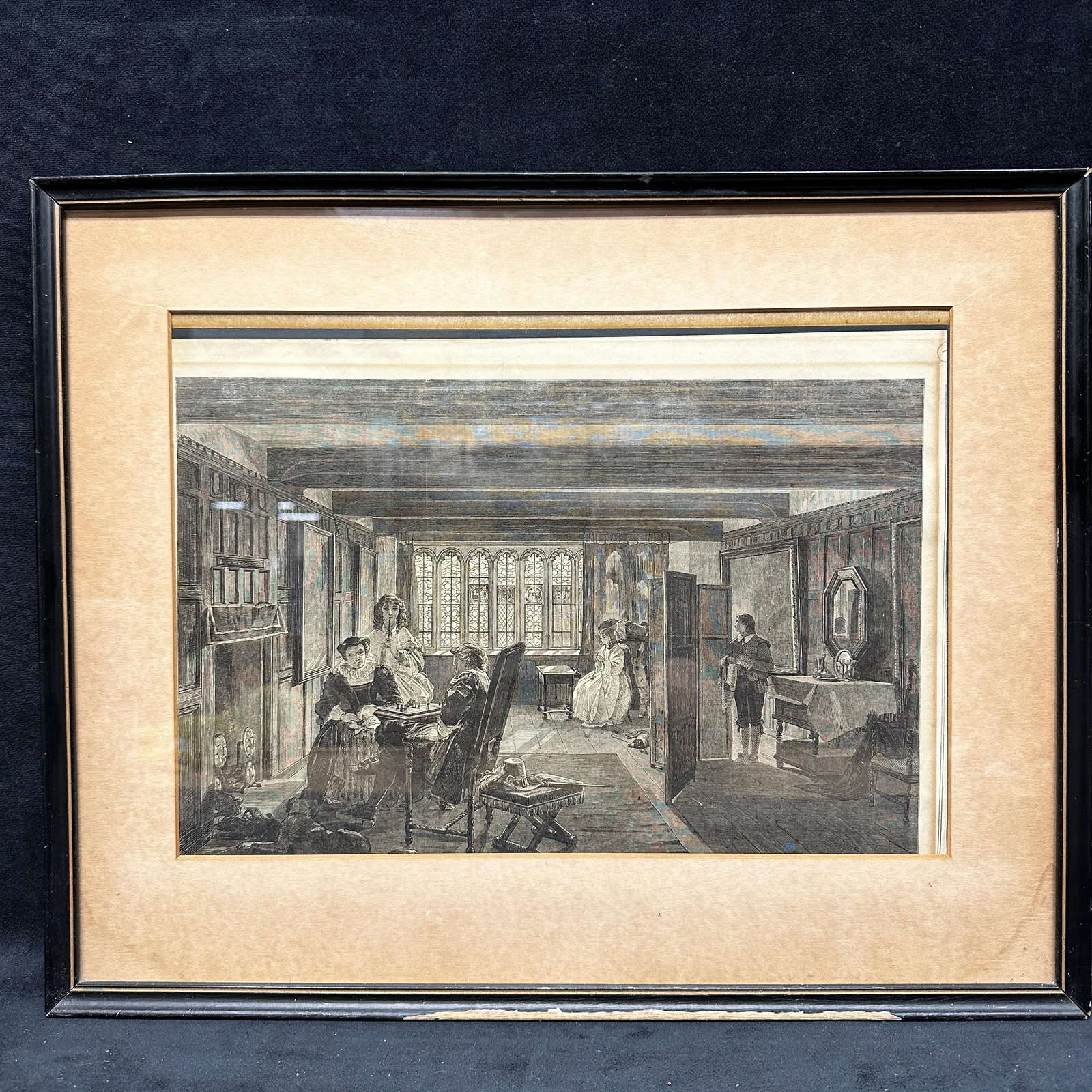 Victorian Interior Genre Scene Framed Engraving Art Print: Black and white engraving depicting a Victorian era interior scene with figures gathered in a domestic room, including seated and standing individuals engaged in conversation. Detailed architectural s