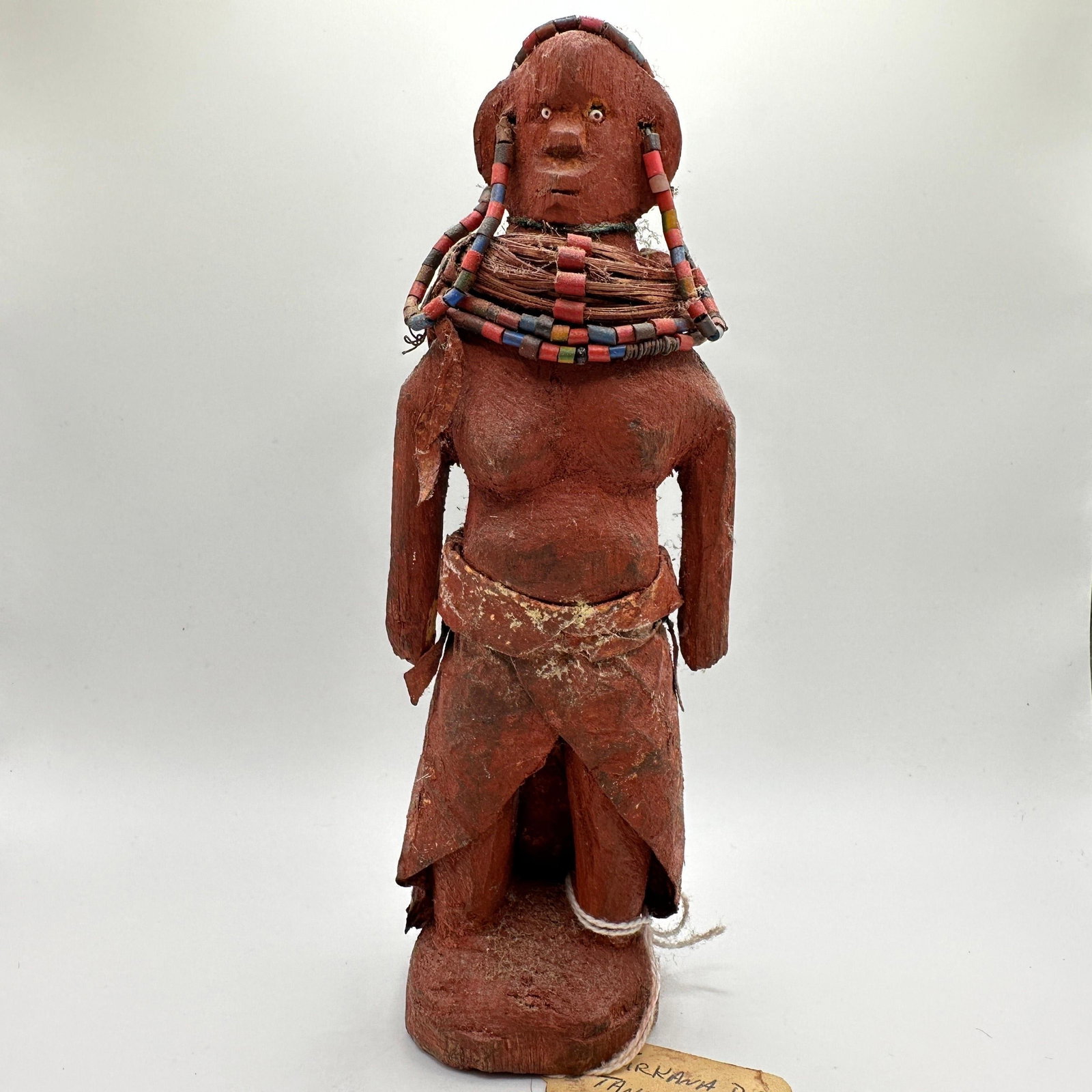 Mid 20th Century Turkana Tribal Doll Kenya Tanzania Wood Beads Animal Hide: Hand-carved Turkana tribal doll from Kenya or Tanzania, mid-20th century. Constructed of carved wood and adorned with ethnic trade beads, fiber wrapping, and animal hide garments, with a surface coate