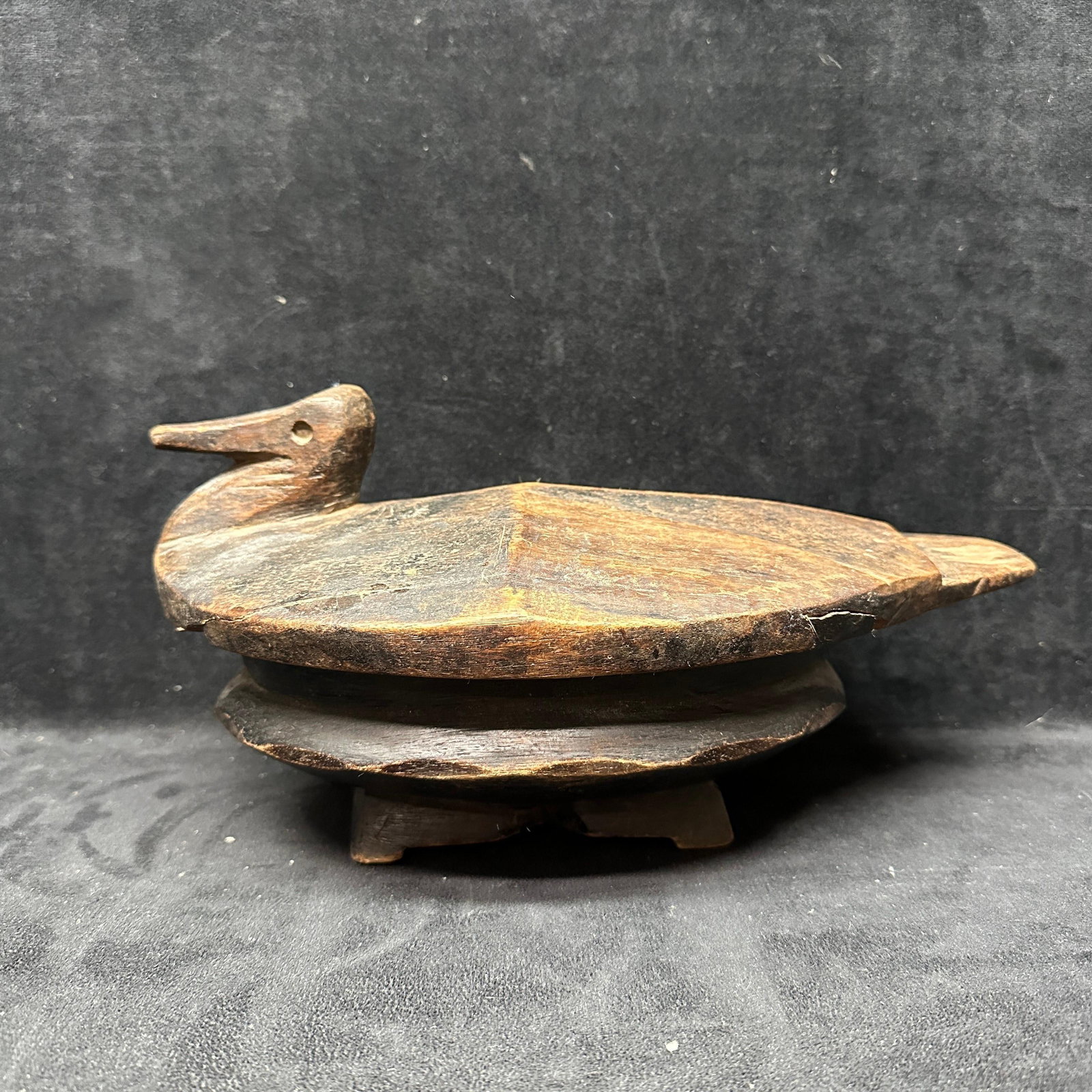 Lozi Carved Wooden Food Bowl With Bird Lid Zambia African Tribal Vessel: Hand-carved wooden food bowl attributed to the Lozi people of Zambia, featuring an oval form with fitted lid surmounted by a stylized bird figure. The bowl rests on a carved base and shows traditional