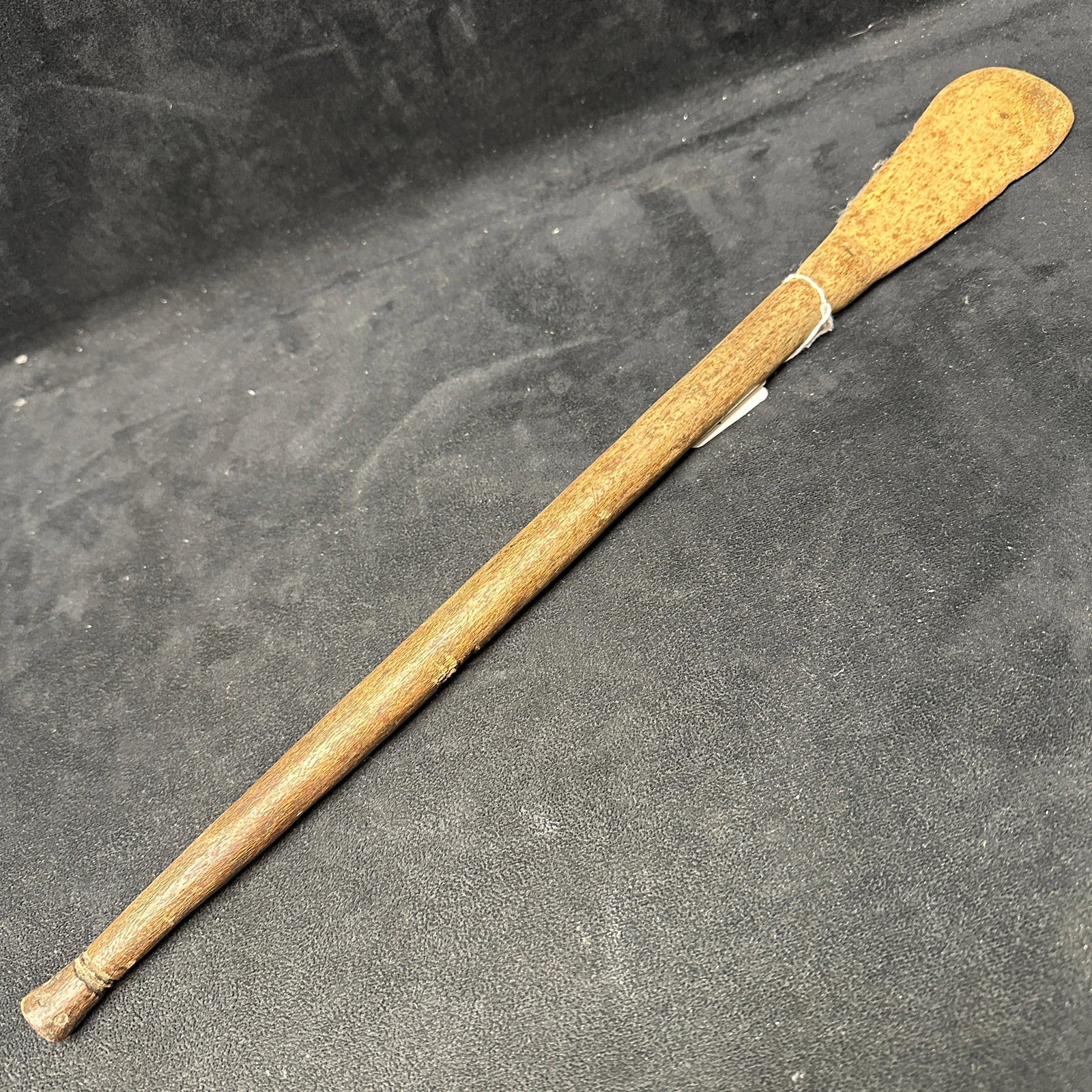 Mid 20th Century African Nshima Tribal Wooden Cooking Spoon Folk Art: Hand-carved African wooden Nshima spoon or paddle used in the preparation of corn meal, a staple tribal food. Features an elongated tapered handle with a broad, rounded paddle end. This folk-art piece