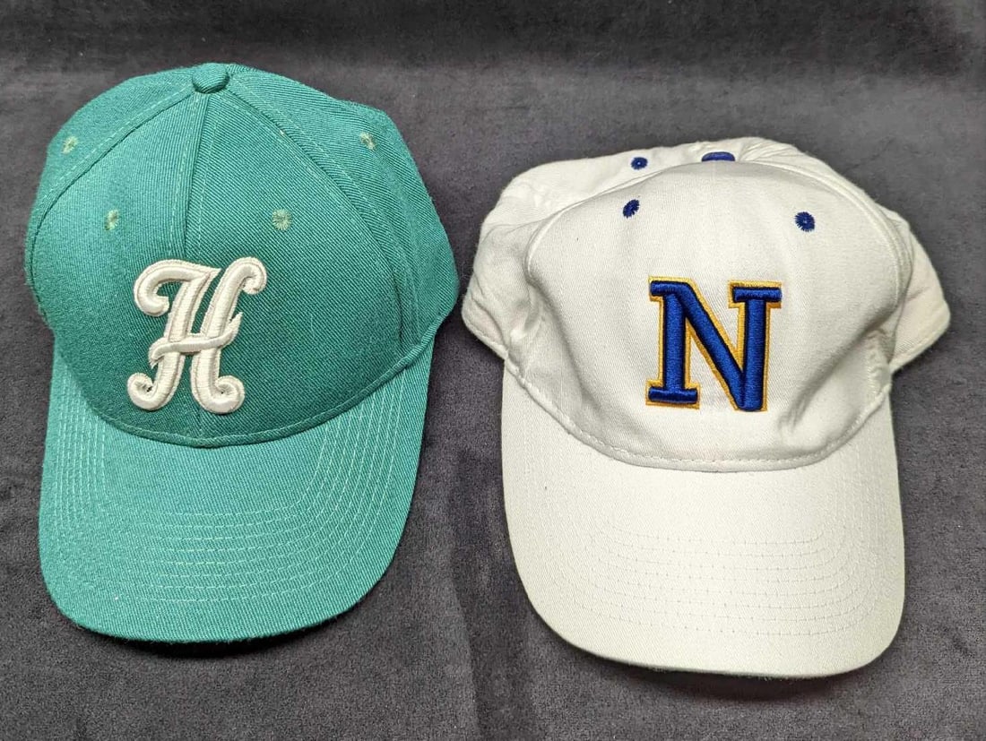 2 Rangers & Huskies Baseball Caps: 2 Rangers & Huskies Baseball Caps. This lot includes: (1) Huskies Cap By Milwaukee Sporting Goods. Size Medium. This is approx 7" x 9" x 5". (1) Rangers Cap By Calhead. Size Medium/Lar