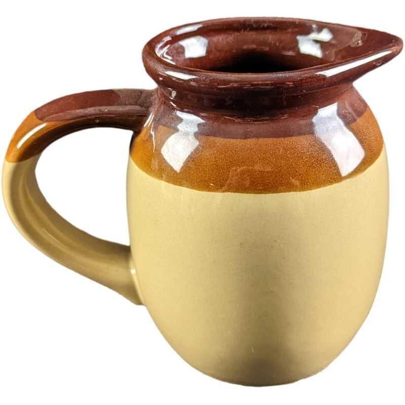 Vintage Stoneware Pottery Pitcher: Vintage Stoneware Pottery Pitcher. Does not have a maker's mark. Is approx 7" x 5" x 6" and it weighs 1.74lb. Is in a good, vintage condition with some imperfections/pinholes in the pottery. Please se