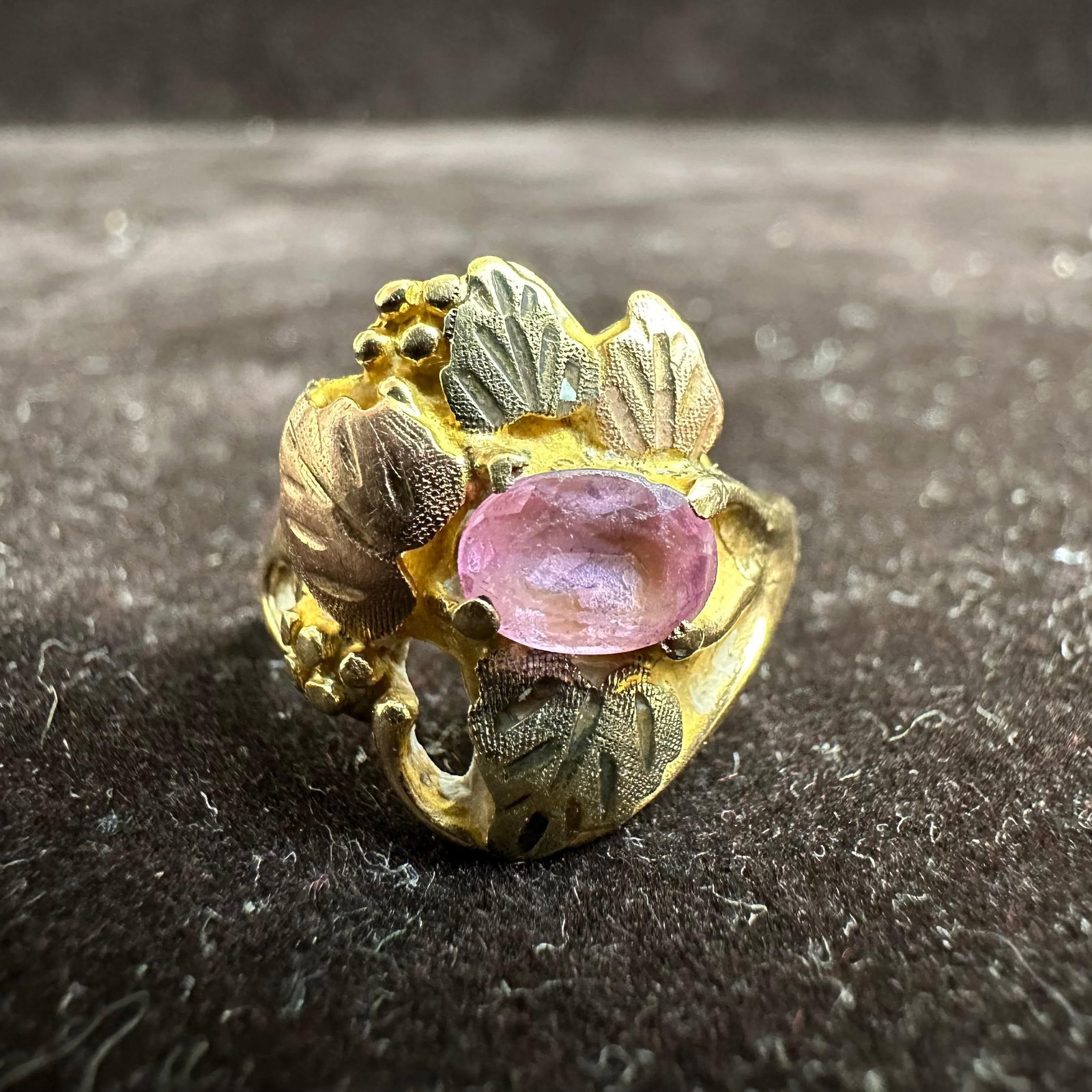 Tri-Color Leaves Leaf Motif Black Hills 10K Yellow Gold Pink Stone Ring M17: This item is in good pre-owned, previously used/displayed condition with noticeable light wear and surface scratches. Please reference all photos for full details. This piece of jewelry has been teste