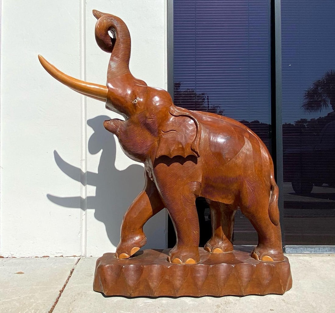 Exquisite vintage hand carved teak wooden Colossal Elephant: Exquisite vintage hand carved teak wooden Colossal Elephant. Size 60" tall X 40" long X 16" Deep 296 lbs . In good condition, some wear expect for it age and a split on