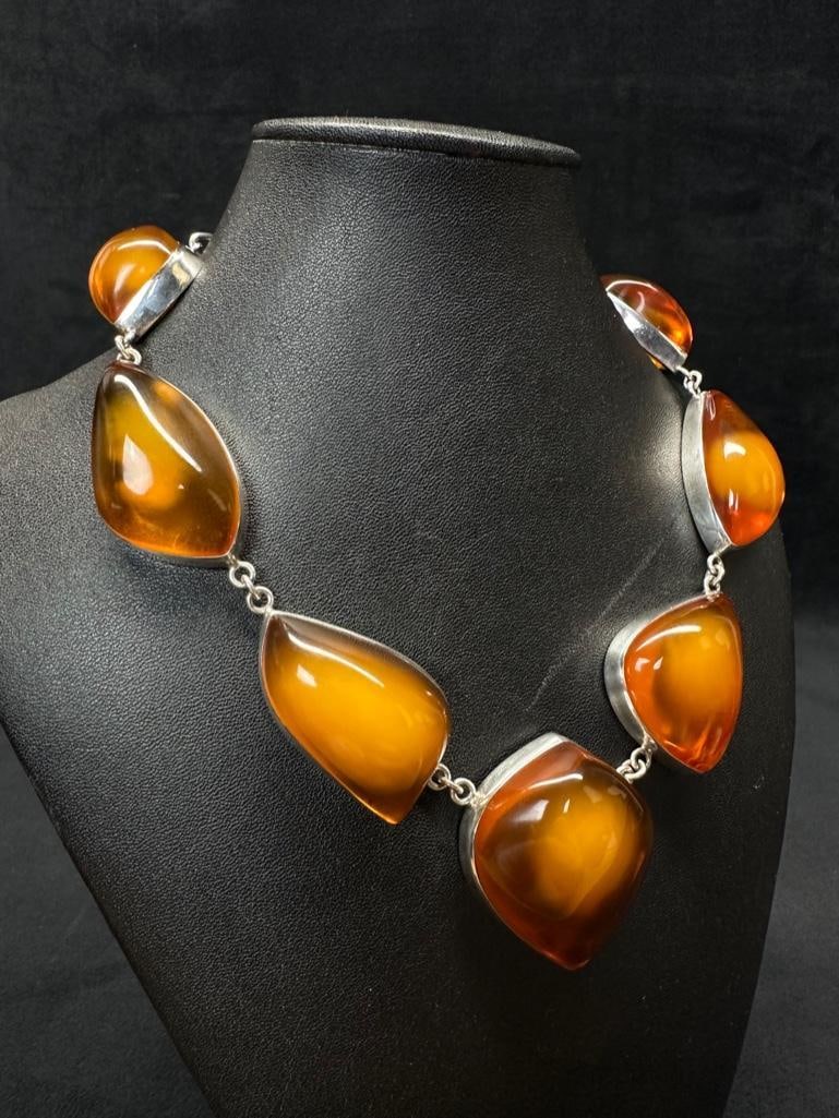 Beautiful Clean Honey Amber Set in Sterling Silver: This piece of jewelry has been tested and researched prior to listing. Please view all our pictures they are part of our description. DETAILS: Metal - 925 Sterling Silver Color - Silver Stones - Honey