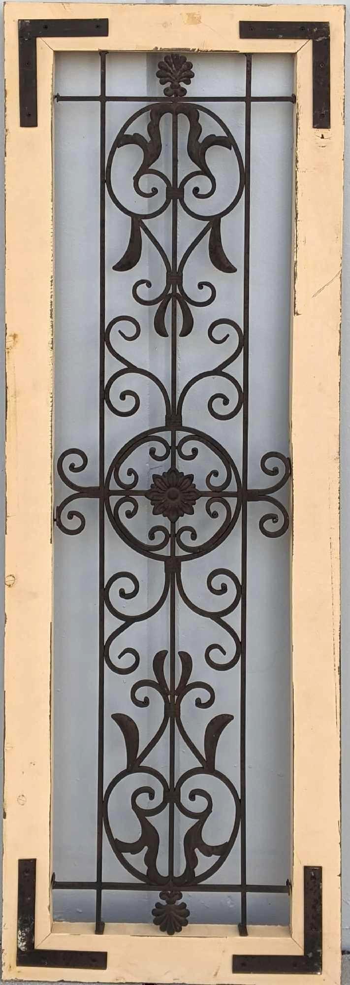 Metal Wall Home Decor Rustic Decoration: Metal Wall Home Decor Rustic Decoration This item is a lovely wall decoration that replicates an ornate garden gate framed in wood. The wood has a rustic finish but also a few flaws that are