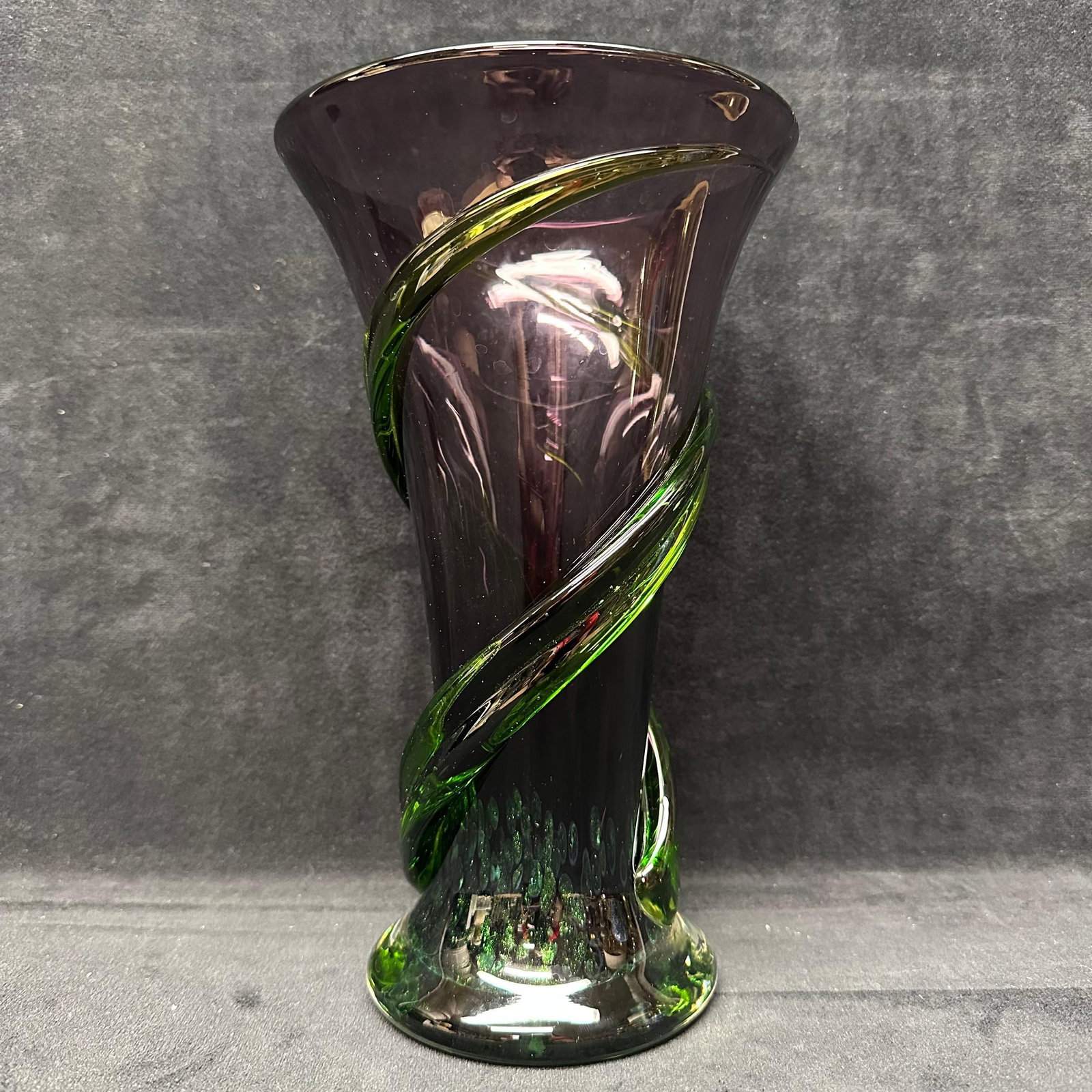 Amethyst and Green Art Glass Vase with Applied Spiral Decoration Telefora: Art glass vase featuring a translucent amethyst-colored body with applied green spiral glass wrapping the exterior. Flared rim with a clear-to-green glass base showing controlled bubble decoration nea