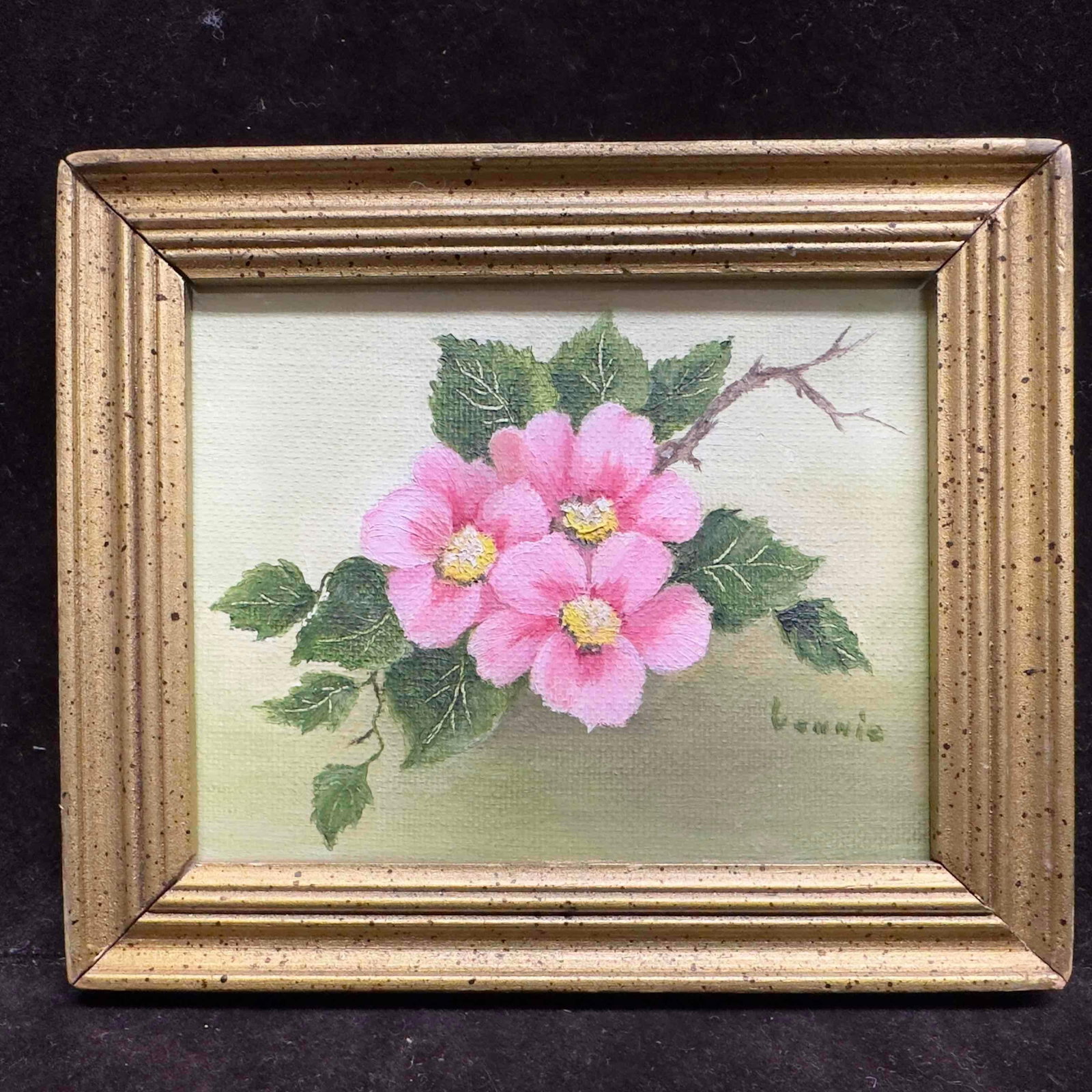 Vennie Grant Pink Flower Floral Cluster Small Oil On Canvas Framed: Vennie Grant Pink Flower Floral Cluster Small Oil On Canvas Framed. This is a charming oil painting depicting a delicate cluster of pink wild flowers against a soft, pale green background. The