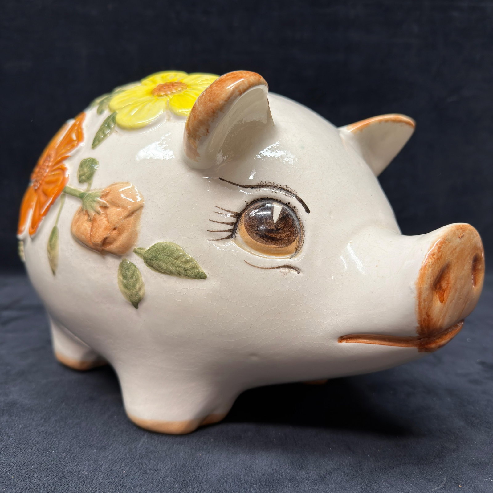 Vintage Lefton Floral Ceramic Piggy Bank Mexico: Lefton ceramic piggy bank featuring raised orange and yellow floral decoration with green leaves and hand-painted facial details. Retains the original Lefton Trade Mark Exclusive foil label on the und