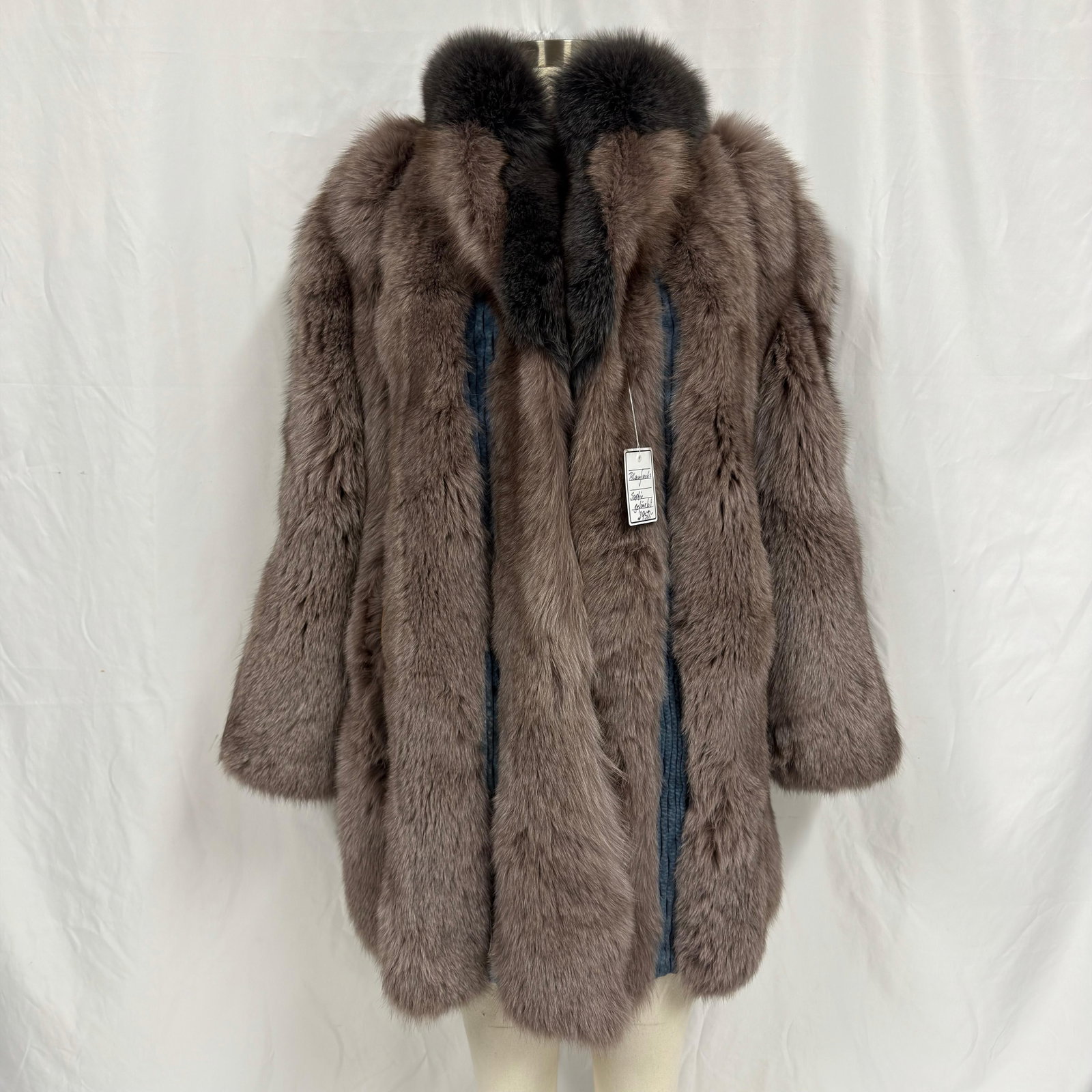 Fox Gray Striped Texture Panel Detailing Fur Coat: The fur coat appears to be crafted from genuine fur (exact species unknown) and retains excellent volume and softness. Overall, the Fur Coat is in good pre-owned condition, with some light wear from