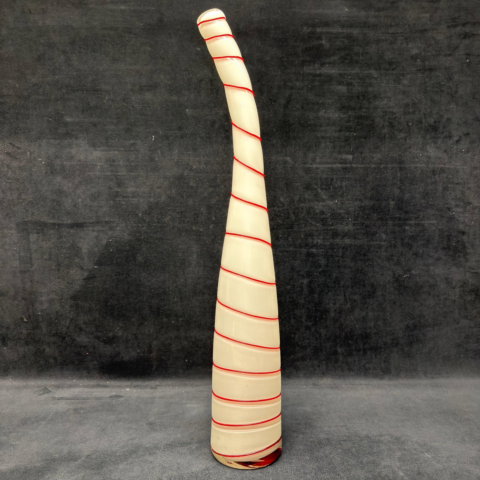 Murano MCM Tall Art Glass Candy Cane Red and White Stripe Spiral Curved Vase: Tall hand-blown art glass sculpture with an elongated curved horn form. Features opaque white glass wrapped with a continuous applied red spiral thread and a thick clear glass base with red interior a