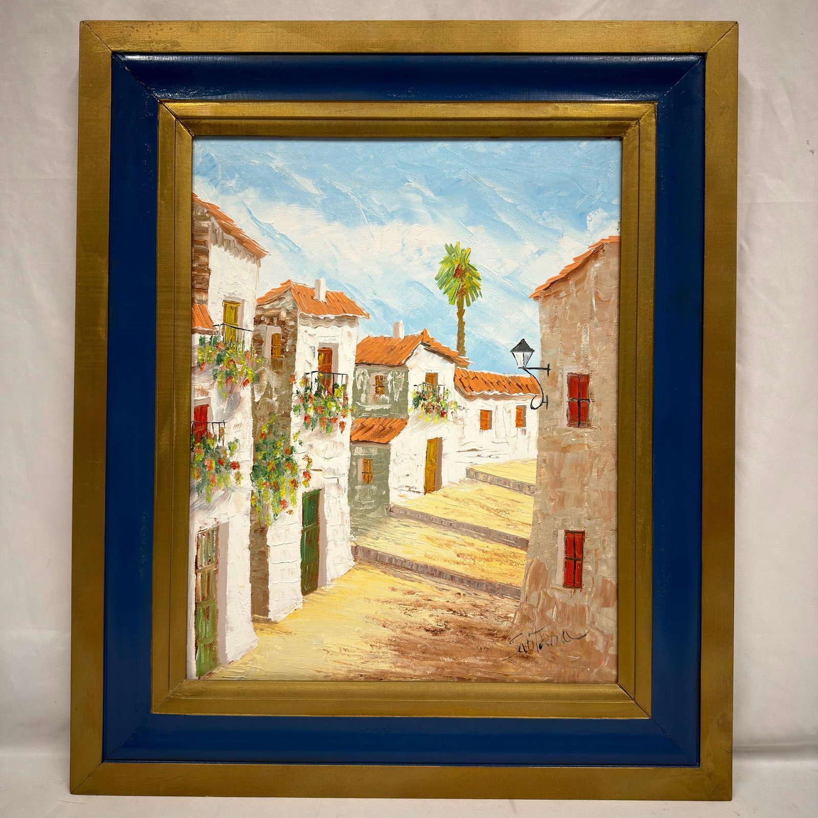 Santana Signed Artwork Painting Framed Gold Tone: Vintage original oil painting on canvas board depicting a Spanish or Italian-style village scene. Signed Santana; artist and exact origin unknown. This item is in pre-owned, previously displayed condi