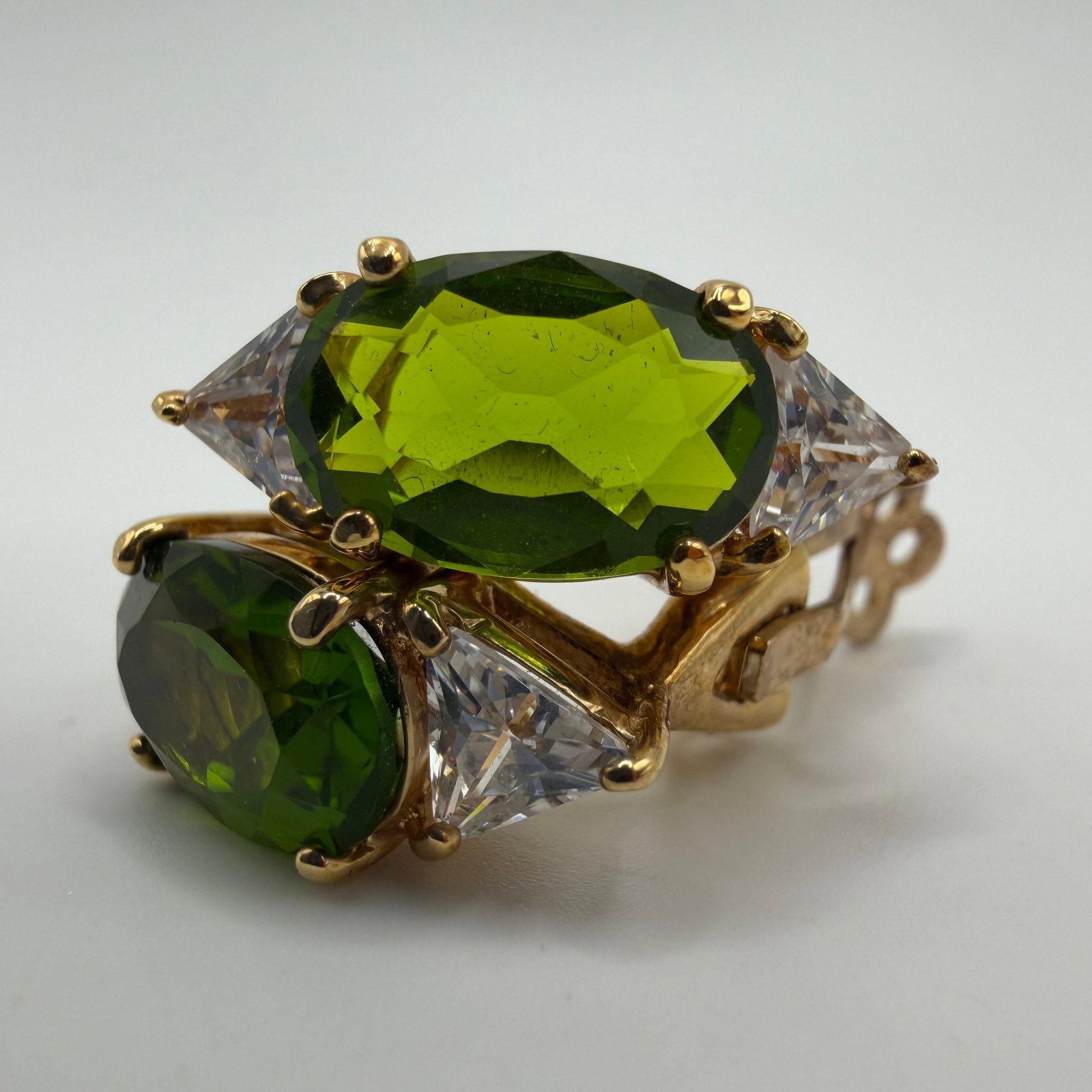 Gold Plated Sterling Green and Clear Cubic Zirconia Clip Earrings: This item is in good pre-owned, previously used/displayed condition with noticeable light wear and surface scratches. Please reference all photos for full details. This piece of jewelry has been