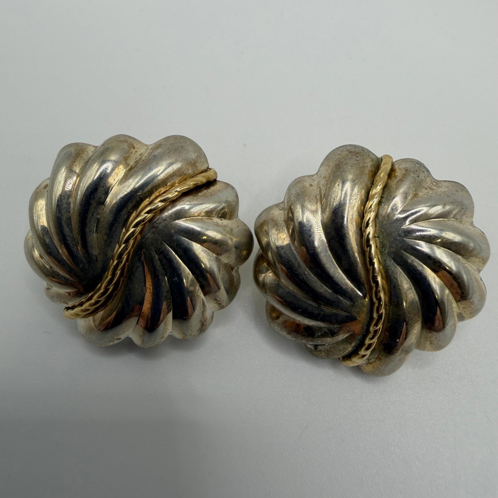 Michael Anthony Sterling Silver and 14K Gold Cable Accent Swirl Ribbed Earrings: These items are in good pre-owned, previously used/displayed condition with noticeable light wear and surface scratches. Please reference all photos for full details. These pieces of jewelry have