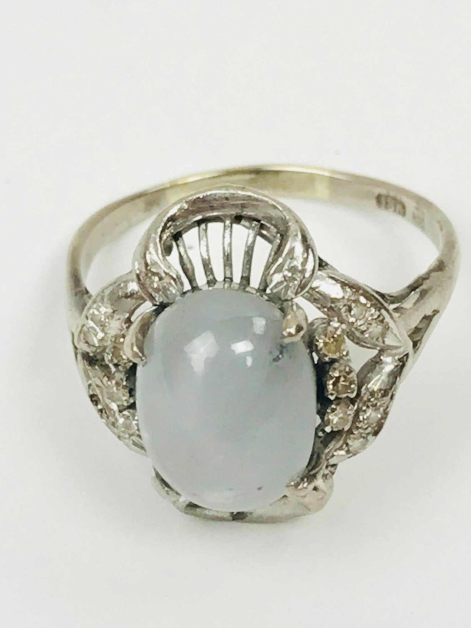 18K Diamond and Star Sapphire Ring Appraised Value $5200: 18k white gold ring four prong set with a single oval cabochon gray star sapphire, also bead set with 18 single cut diamonds. 2018 appraisal @ $5200. The ring weighs 5.8 grams and is a cast and 