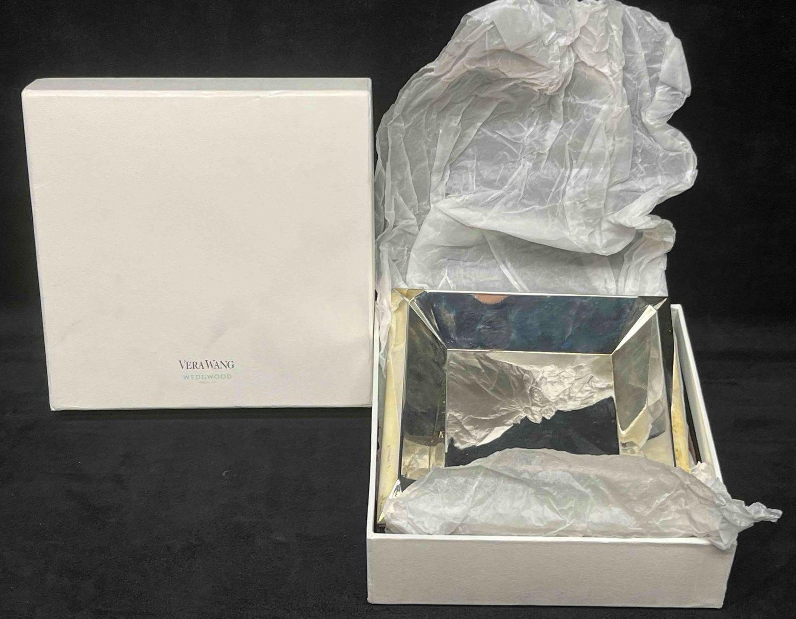 Vera Wang By Wedgwood Peplum Silver Plate Square Tray: This lot contains a Vera Wang By Wedgwood Peplum Silver Plate Square Tray. It is approx 6" x 6" x 1". The box is approx 7" x 7" x 2 1/4". Total weight is approx 1 lb. Overall the Vera Wang By Wedgwood
