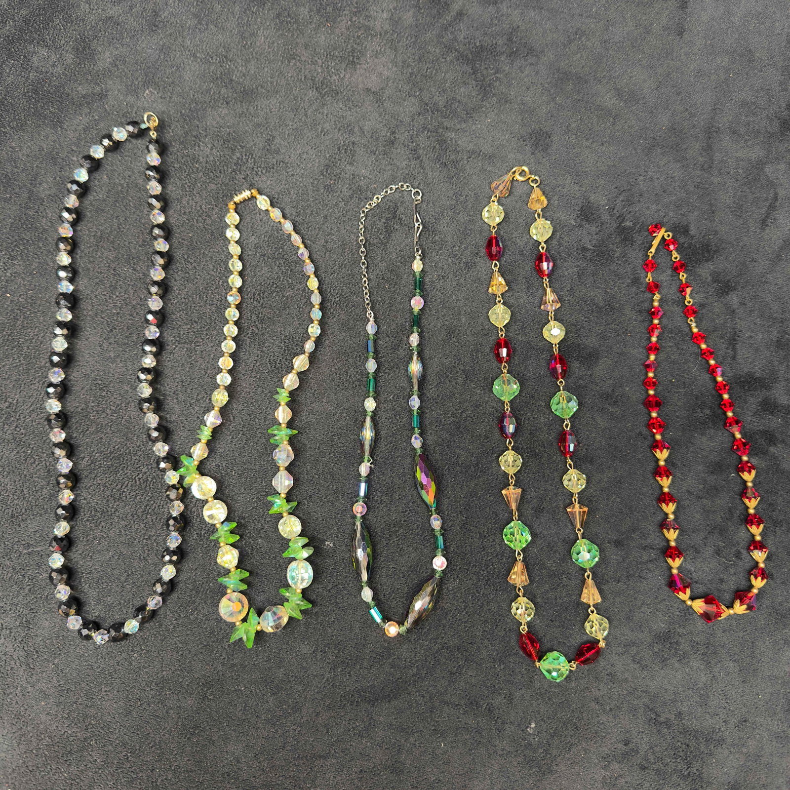 Costume Jewelry Clear Glass Crystal Necklace Set Lot of 5 Five Necklaces I52: Costume Jewelry Clear Glass Crystal Necklace Set Lot of 5 Five Necklaces I52. Necklaces with clear multi colored crystal glass beads with beautiful designs. Each necklace features either a j hook, bar