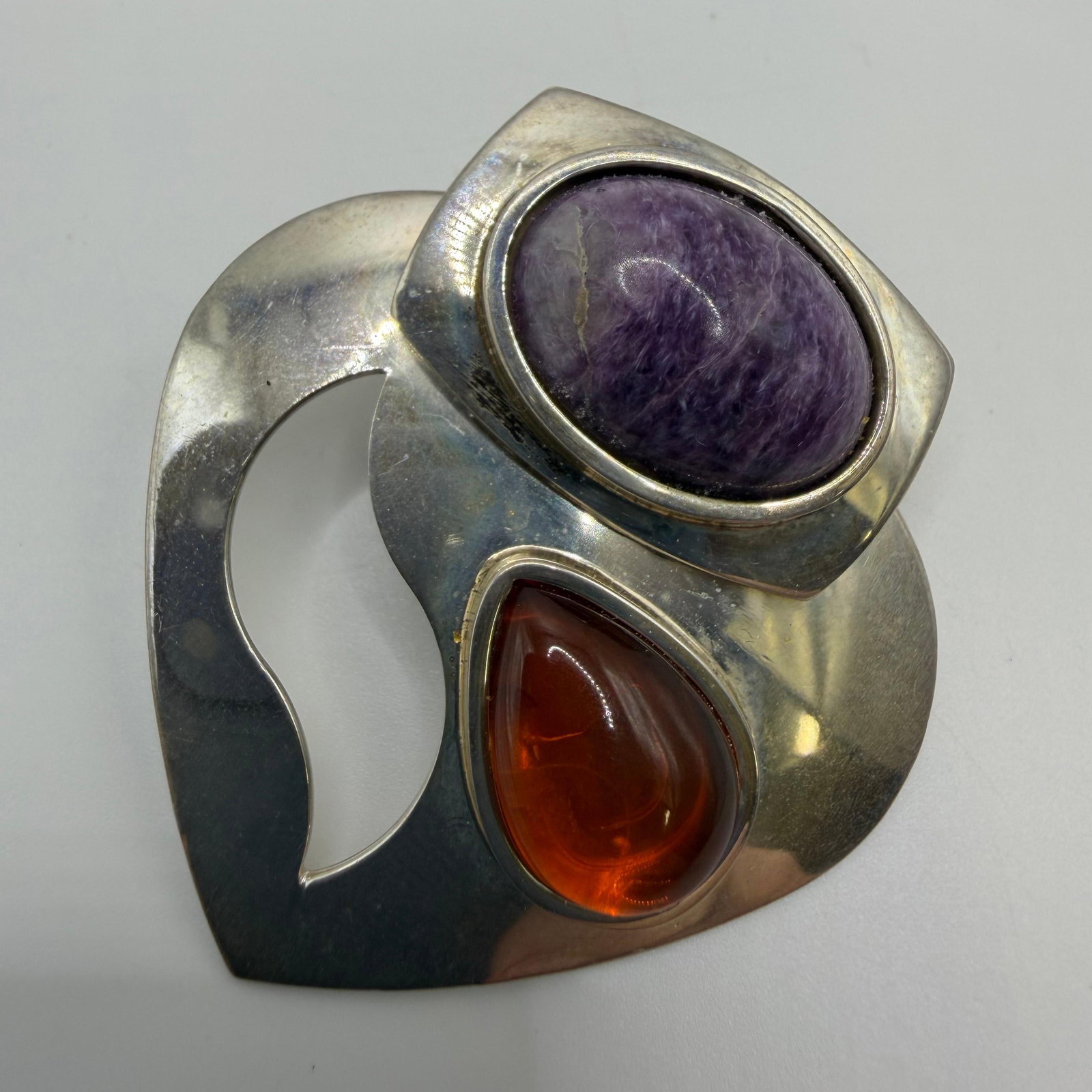 Oval Purple Charoite and Teardrop Amber DTR 925 Sterling Pendant: This item is in pre-owned, previously used/displayed condition with noticeable light wear and surface scratches. Please reference all photos for full details. This piece of jewelry has been tested and