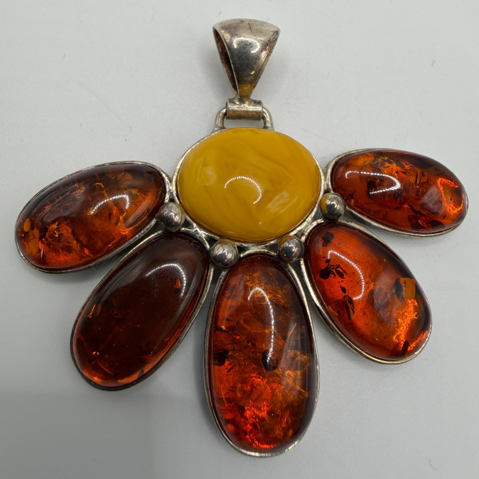 Butterscotch Cognac Amber Floral Sterling Silver Pendant PL V8: This item is in pre-owned, previously used/displayed condition with noticeable light wear and surface scratches. Please reference all photos for full details. This piece of jewelry has been tested