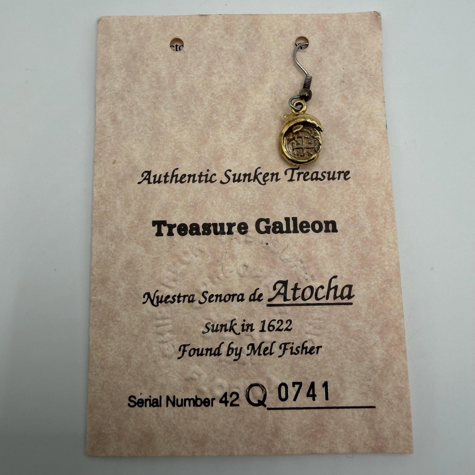 Atocha Shipwreck Silver Coin Dolphin Pendant Earring with Certificate: Authentic Treasure Galleon Nuestra Senora de Atocha shipwreck silver coin jewelry piece in a dolphin-form mounting. Includes the original Certificate of Authenticity identifying the piece as handcraft