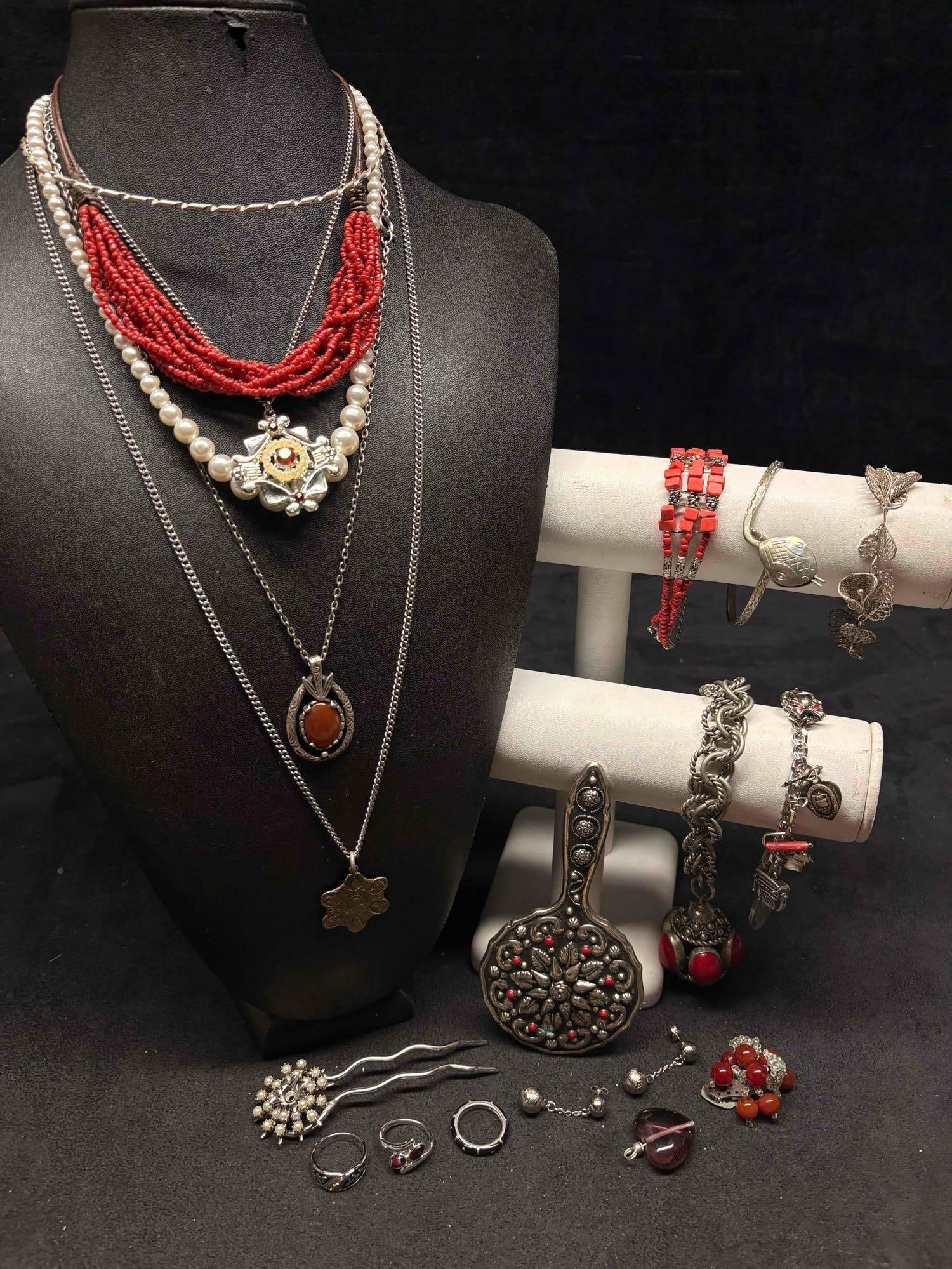 19pc Boho and Silver Artisanal Atlas Costume Jewelry Collection: This lot contains 19 pieces of pre-owned costume jewelry, paired together in a stylized set. Each piece is in good conditions, with wear and tear over the years visible on some of the jewelry. Please 