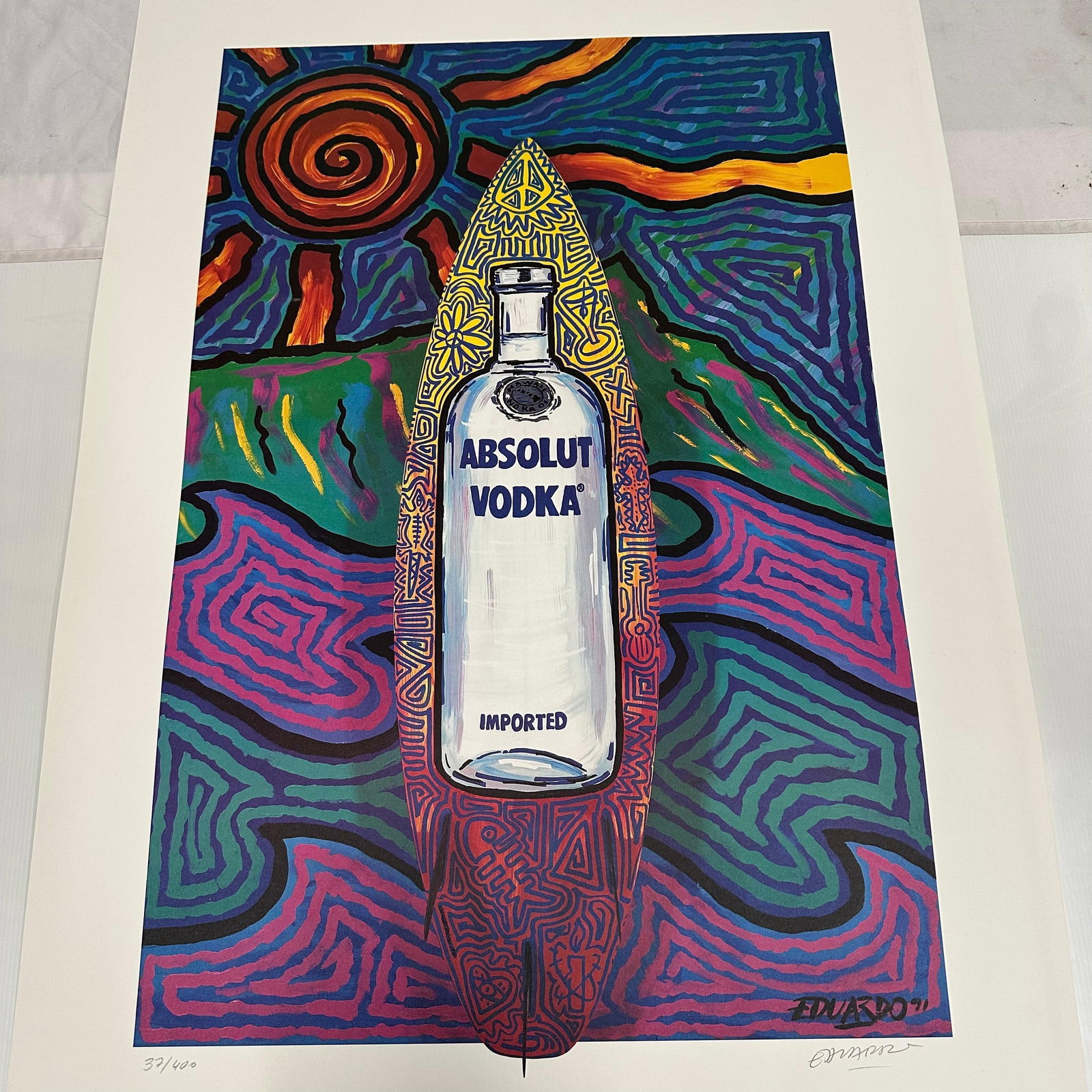 Absolut Vodka Statehood Print Hawaii Eduardo Bolioli Hand Signed and Numbered: Limited edition Absolut Vodka “Statehood” lithograph print on paper. Features the iconic Absolut bottle set against a stylized Hawaii-themed landscape. Hand-signed by the artist, Eduardo B