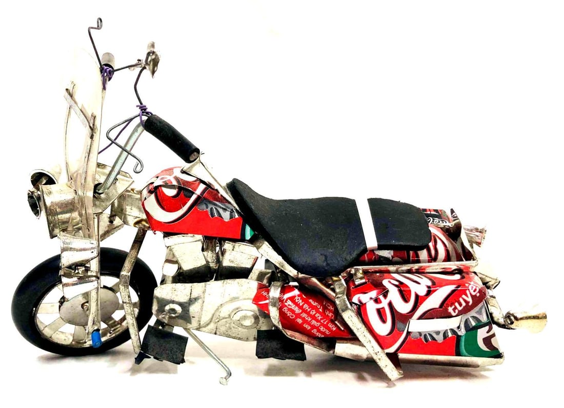 Coca-Cola Soda Can Motorcycle Figurine: This lot contains a Coca-Cola Soda Can Motorcycle Figurine. It is approx 7 3/4" x 2 1/2" x 5" and it weighs about 0.2lbs. Overall the Coca-Cola Motorcycle is in good used condition with some