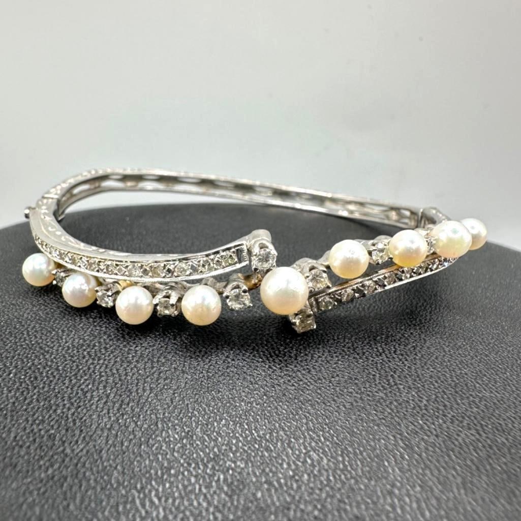 14k White Gold Diamond & Pearl Hinged Bangle: This piece of jewelry has been tested and researched prior to listing. Please view all our pictures they are part of our description. DETAILS: Metal - 14k Gold Color - White/Silver Stones - Diamond,
