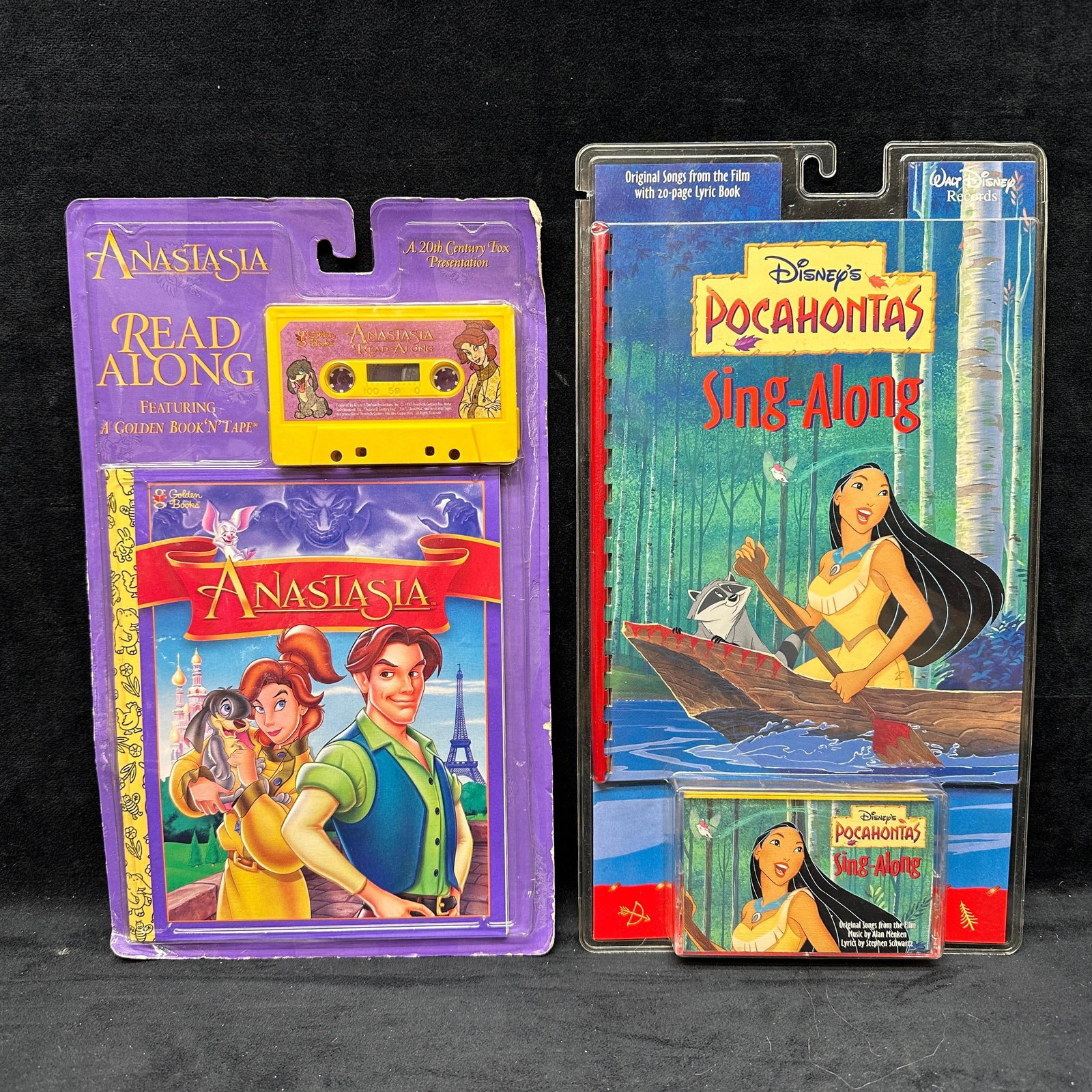 Anastasia Read Along Book And Cassette and Disney Pocahontas Sing Along B: Group lot of two vintage children’s read-along books and cassette sets. Includes Disney’s Pocahontas Sing-Along set with an illustrated lyric book and cassette, and Anastasia Read Along fe