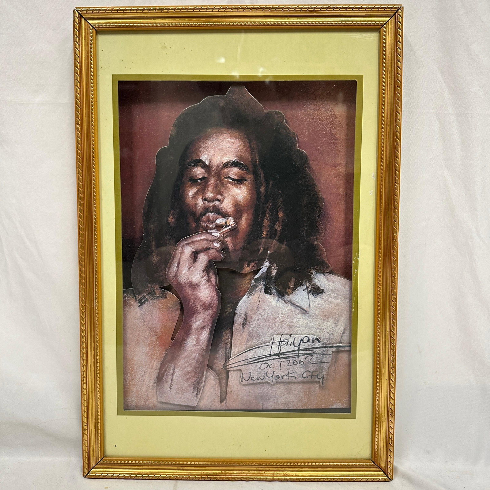 Bob Marley Framed 3D Cutout Print Signed Mixed Media Raised Cutout: Framed mixed media style Bob Marley portrait featuring a raised cutout figure over a printed background. Signed and dated Oct 2002, New York City. Housed in a gold-tone frame with a mat. Appears 
