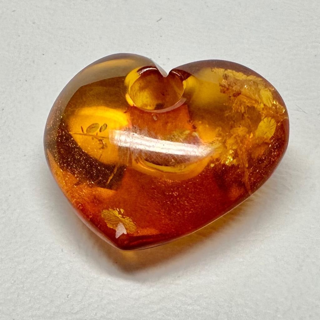 1" Amber Heart Bead/Pendant: This piece of jewelry has been tested and researched prior to listing. Please view all our pictures they are part of our description. DETAILS: Metal - none Color - Amber Stones - Amber Hallmarks -
