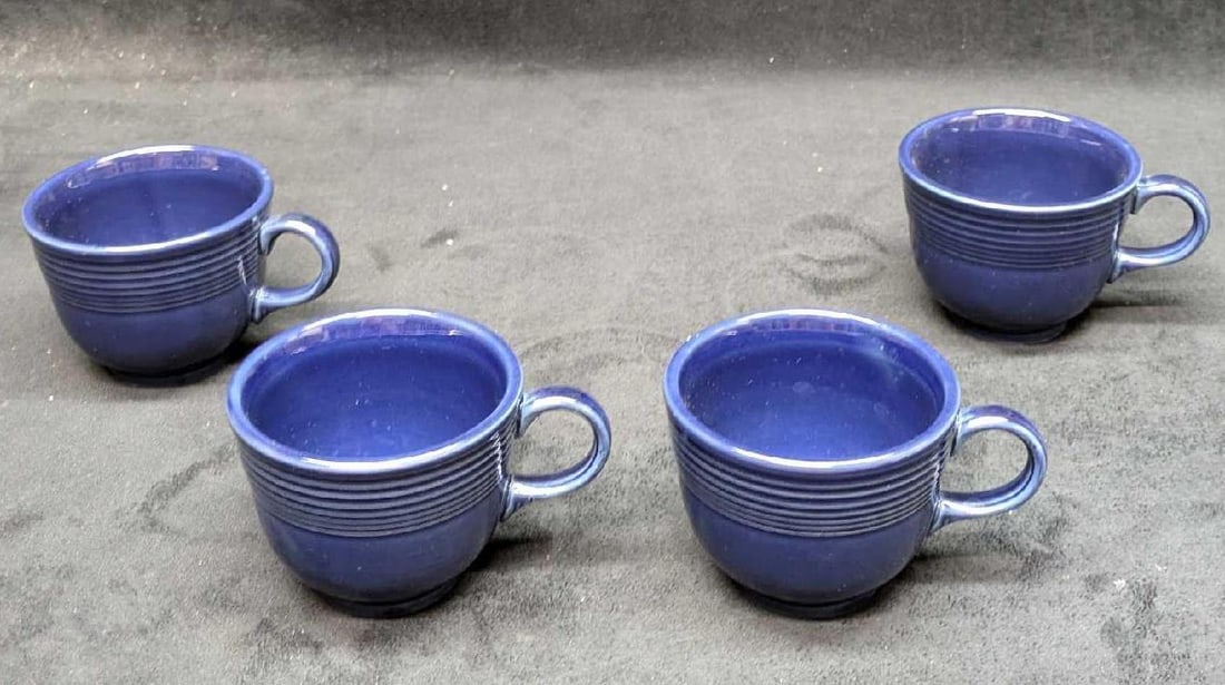 4 Twilight Fiestaware Flat Cups B: 4 Twilight Fiestaware Flat Cups B. Each is approx 4 1/2" x3 1/2" x 2 3/4" and the total weight is 2.09 lbs. The cups have some light scratches and some of the cups have markings on the bottom, but