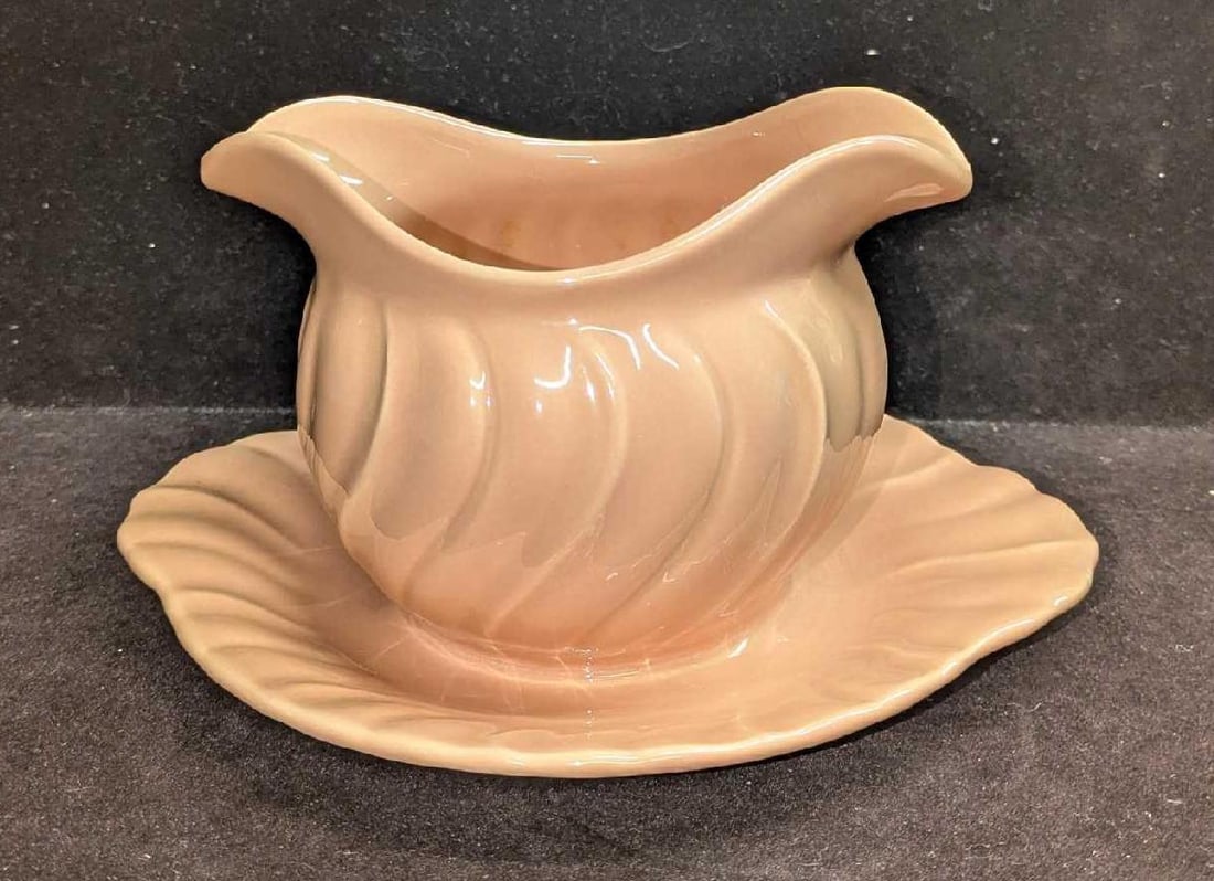 Vintage Pink Coral Franciscan Gravy Serving Bowl: Vintage Pink Coral Franciscan Gravy Serving Bowl. This is approx 8" x 6 3/4" x 3" and it weighs 1.16lb. The bowl has some wear on the bottom, along with a small imperfection on the bottom (small blist